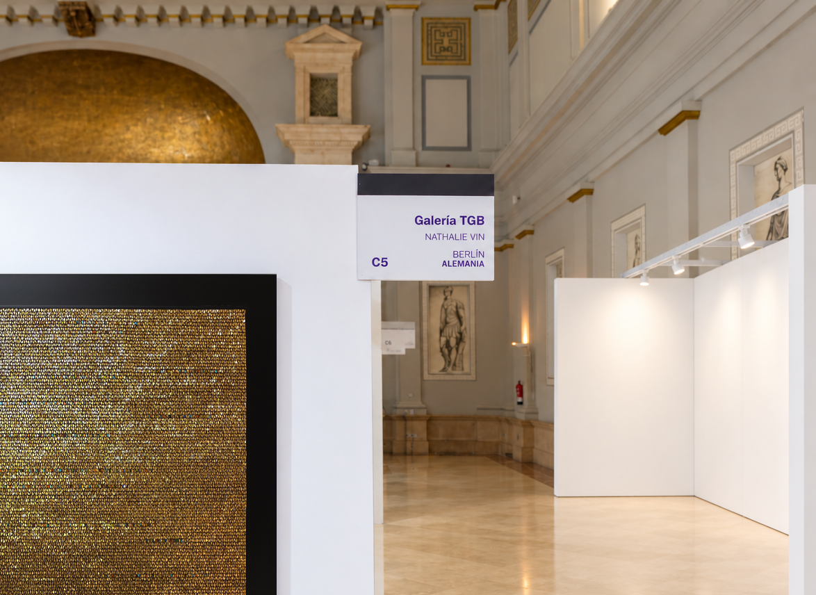 White exhibition booth beside golden artwork2.png