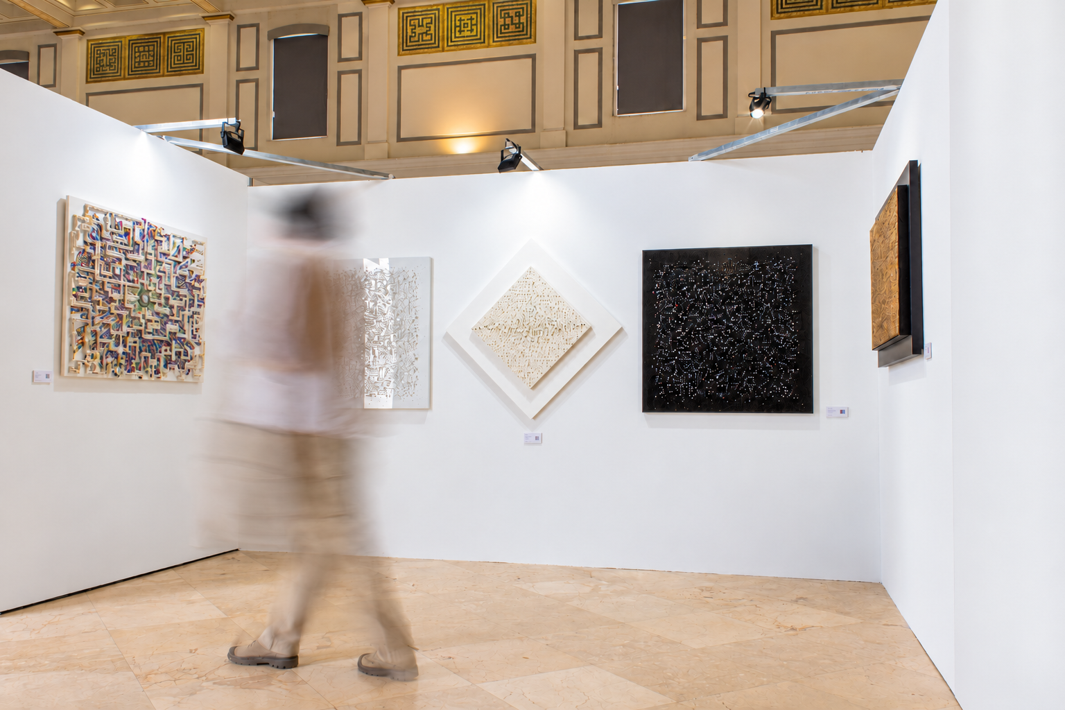 White partition conceals neighboring art booth.png