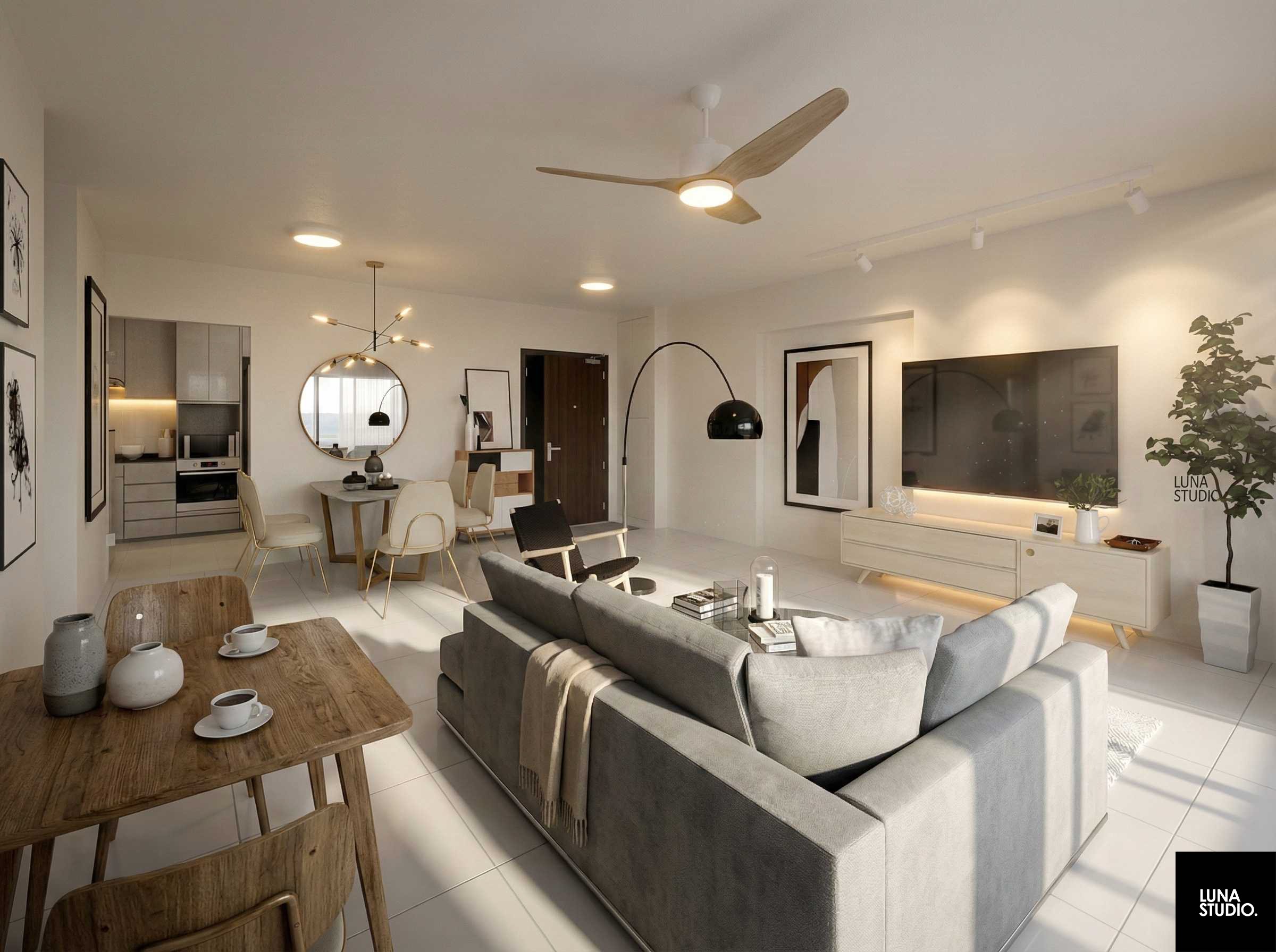 Modern open-concept living room and dining area with minimalist decor, a large gray sectional sofa, a wooden dining table with four chairs, a flat-screen TV, framed artwork, a black arched floor lamp, and a kitchen in the background.