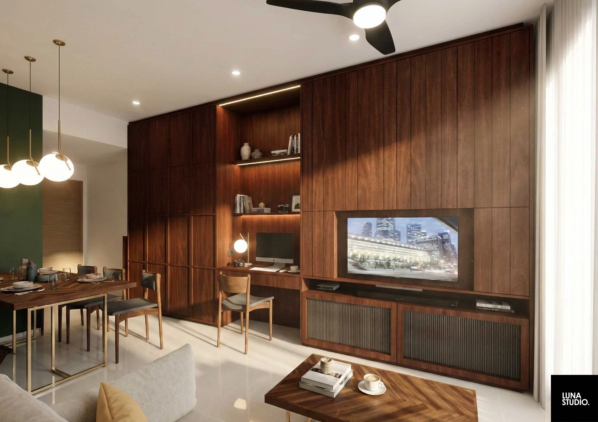 Living room with a wooden accent wall, mounted flat-screen TV, shelves with decorative items, desk workspace with a monitor and lamp, dining table with chairs, coffee table with books and coffee, curtains on a large window, ceiling fan, modern lighting fixtures.