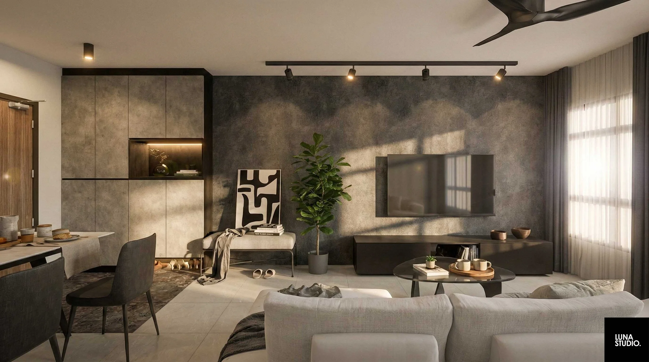 Modern living room with a gray feature wall, wall-mounted TV, large window with curtains, potted plant, black TV console, and a white sofa. There's a small table with cups, a bench with a black and white artwork, and a bookshelf. The room has track lighting and a ceiling fan.