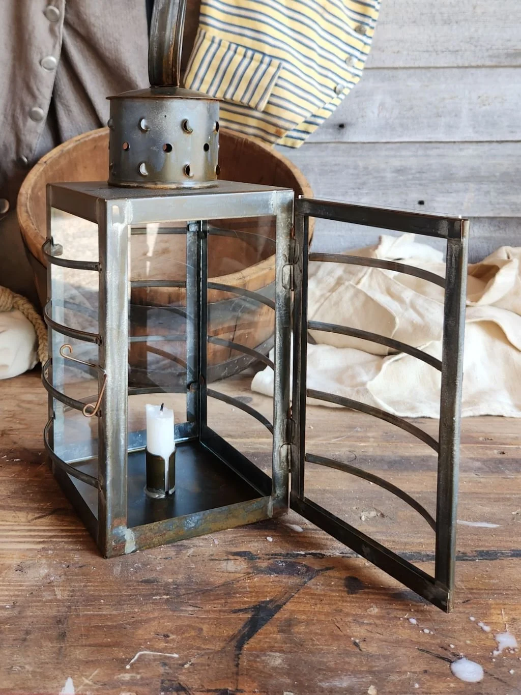 Traditional square tin watch lantern with clear glass.