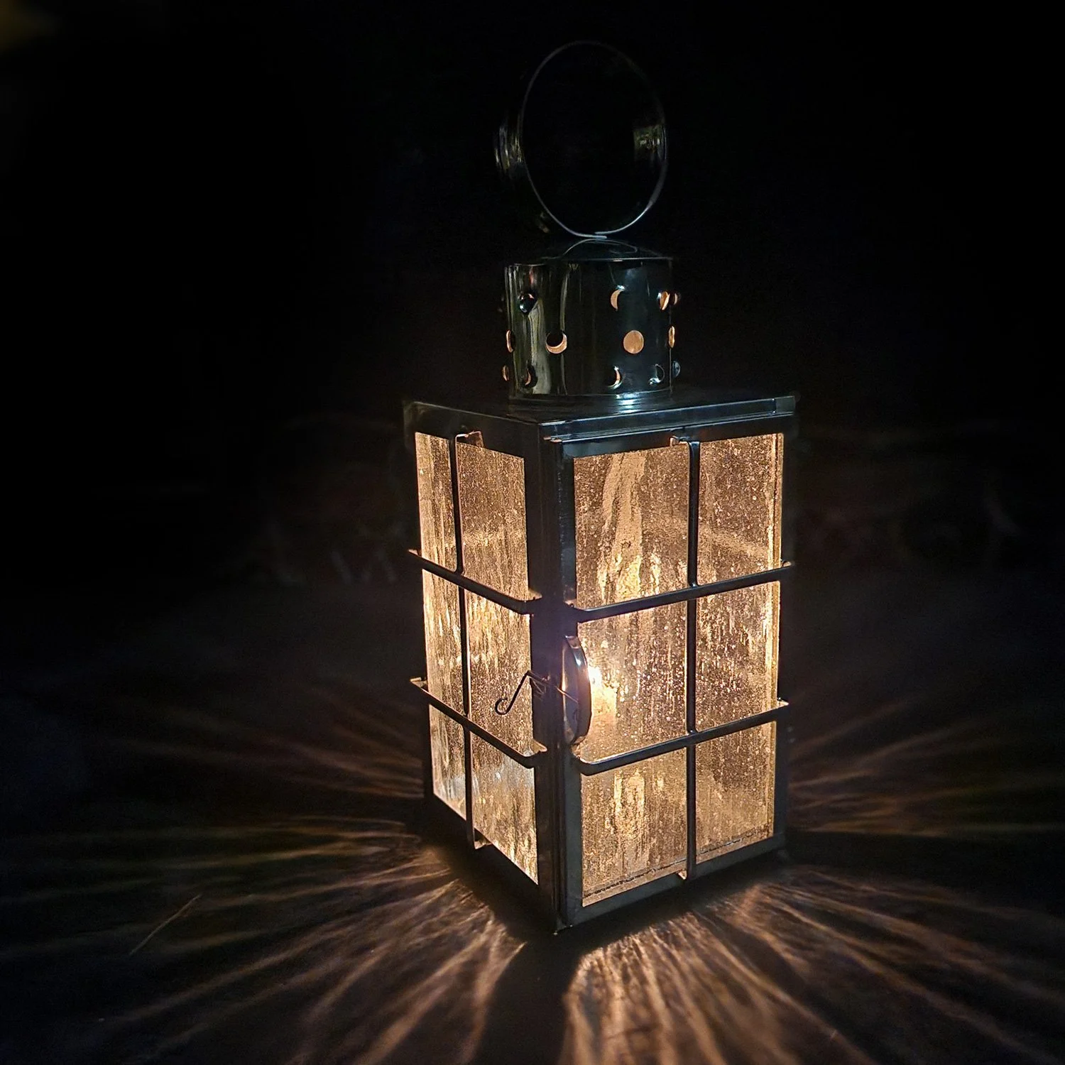 square ship lantern lit by candle.