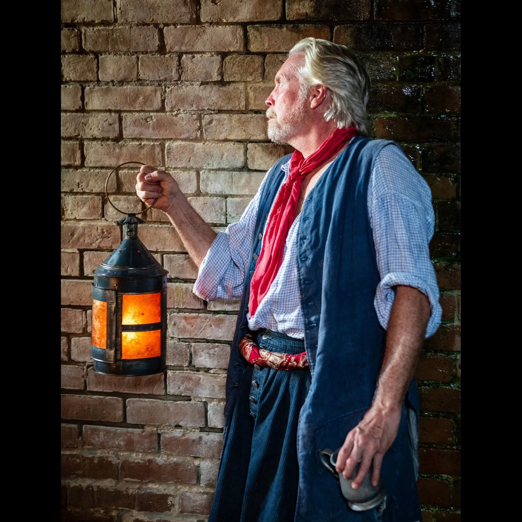 Pirate holding a round tin ship lantern made by Rob Gorrell (Copy)