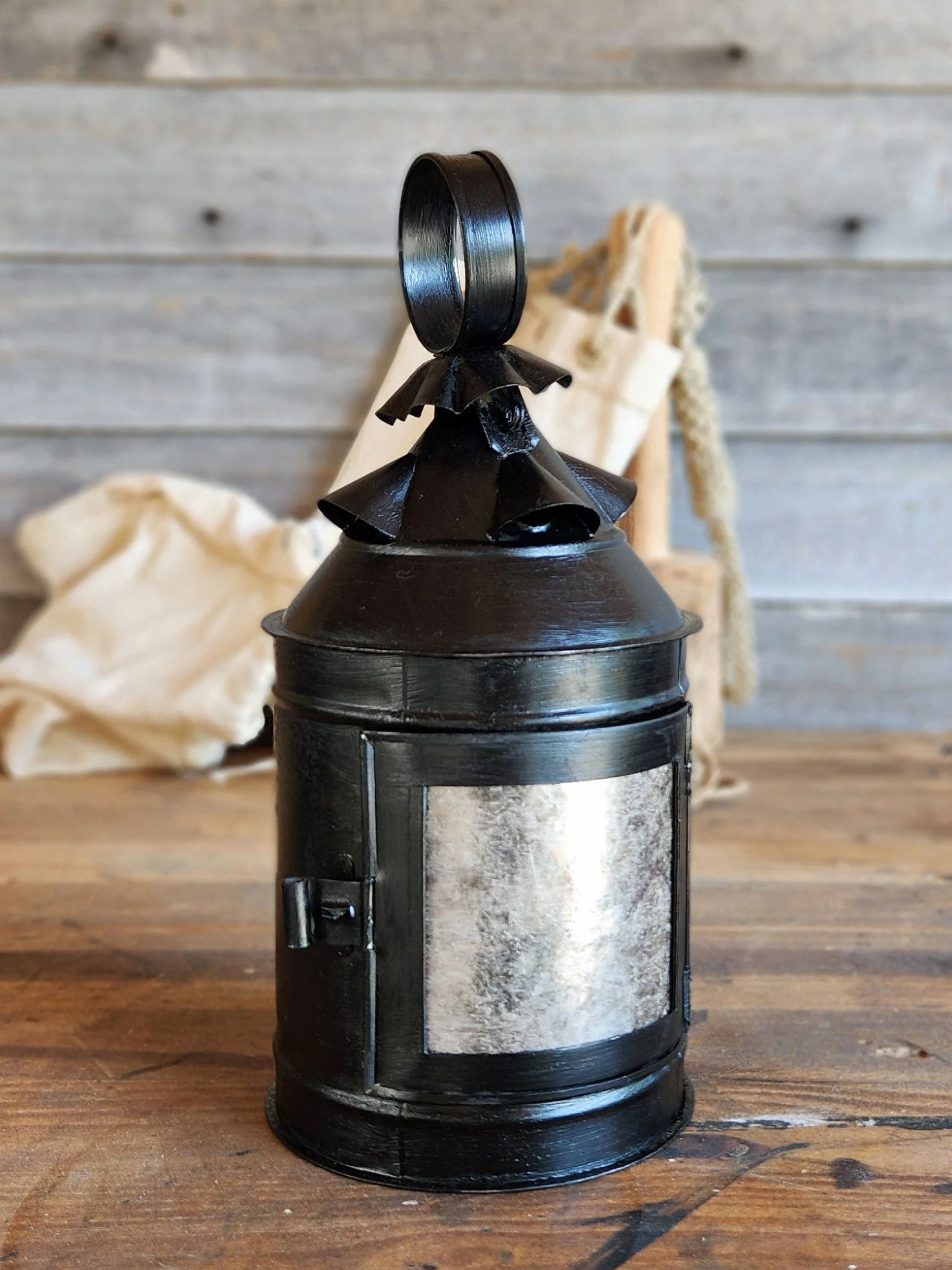 Round handmade 17th-century style tin lantern.
