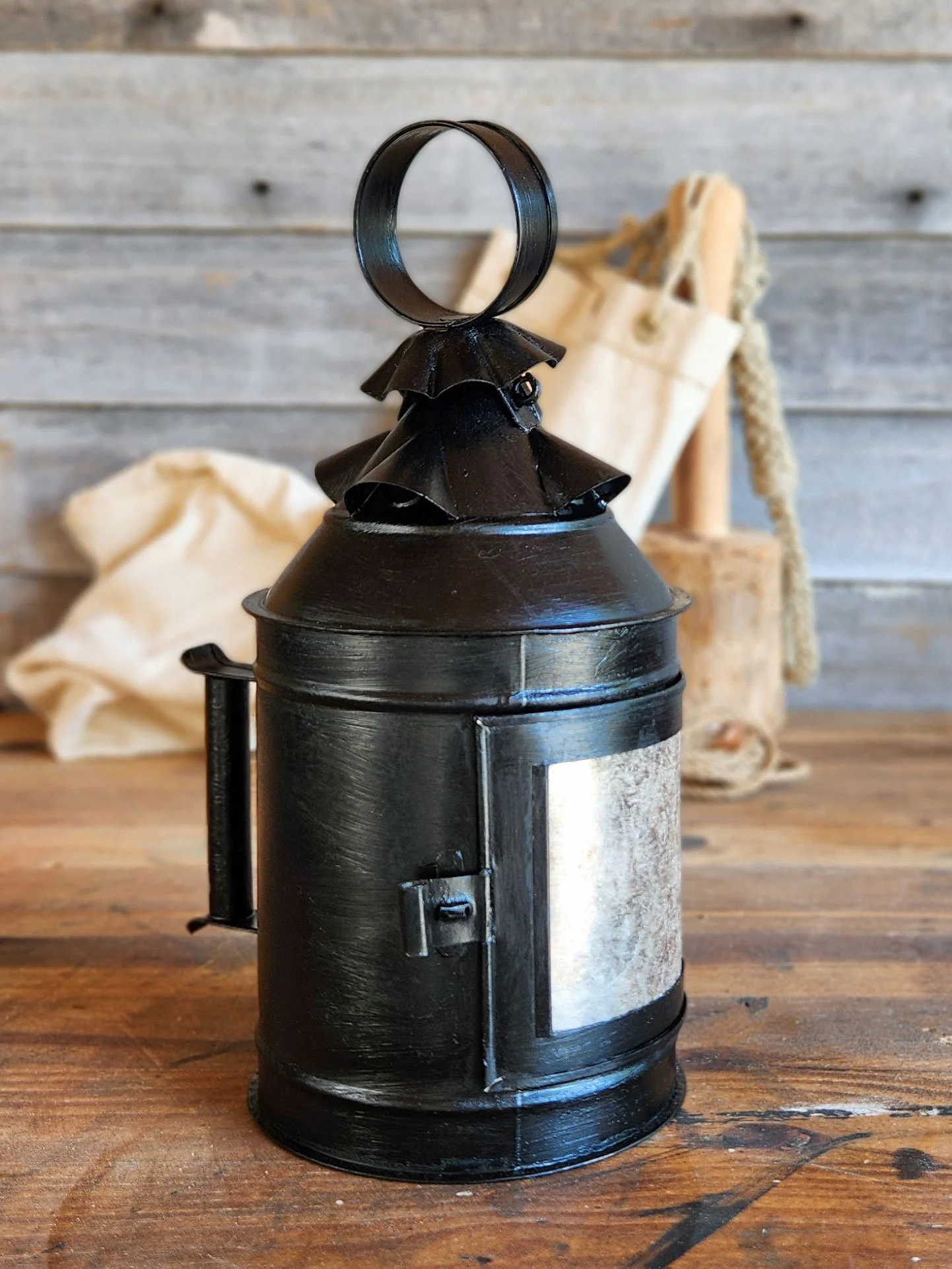 Black handmade 17th-century tin lantern.