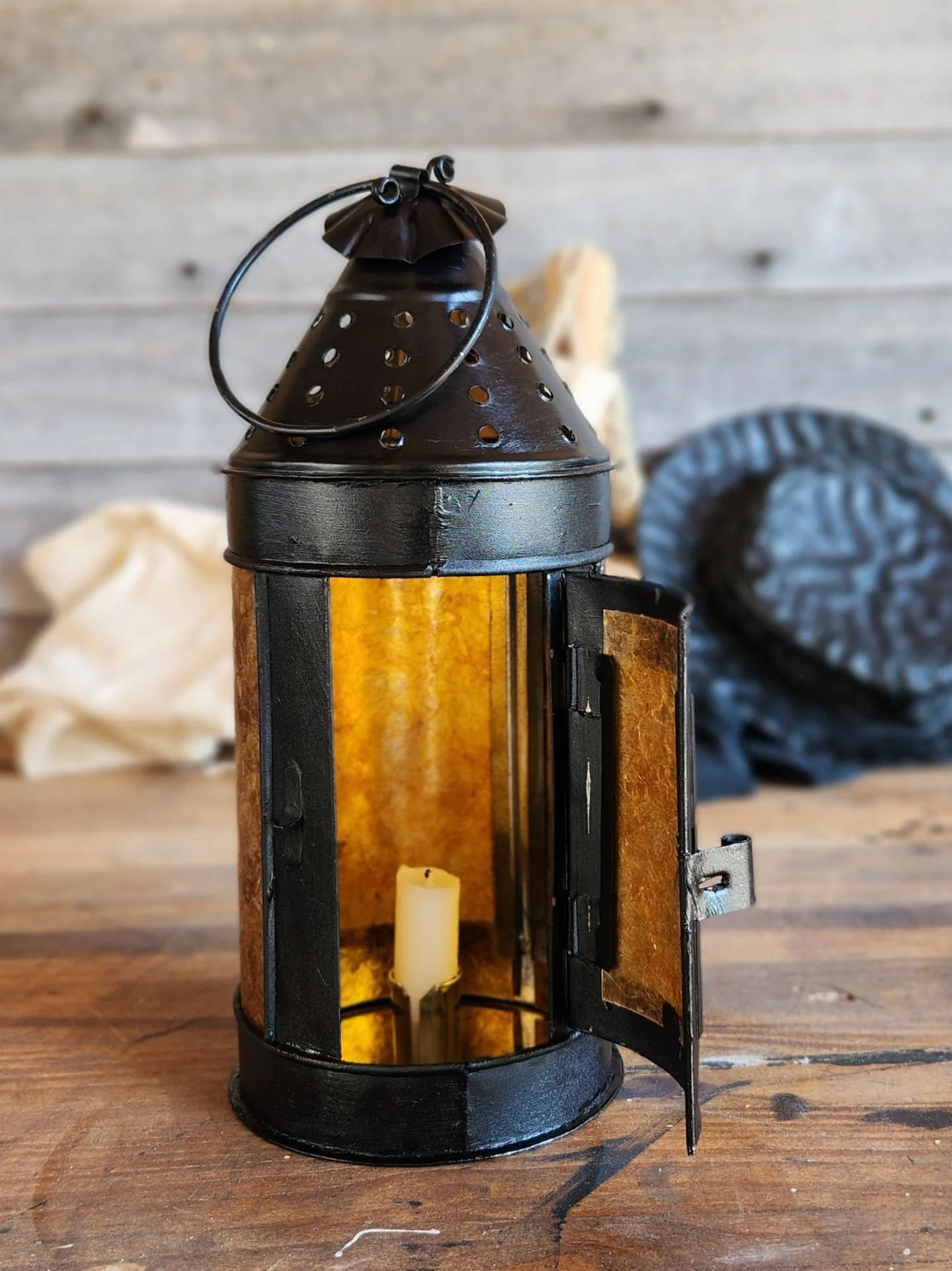 Handmade round 17th century hand lantern with wire carrying ring on top.