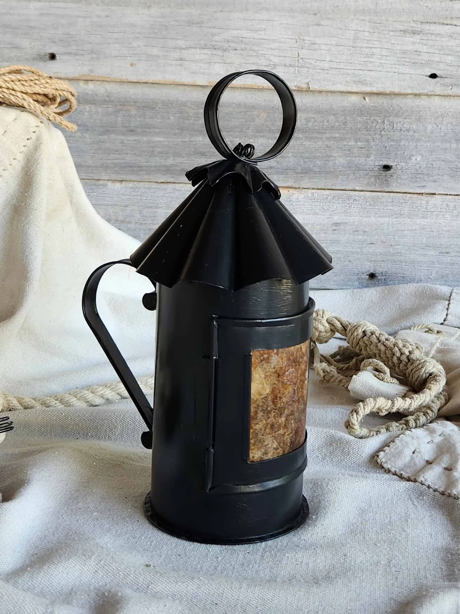 Black "Honest Lantern" with amber door pane