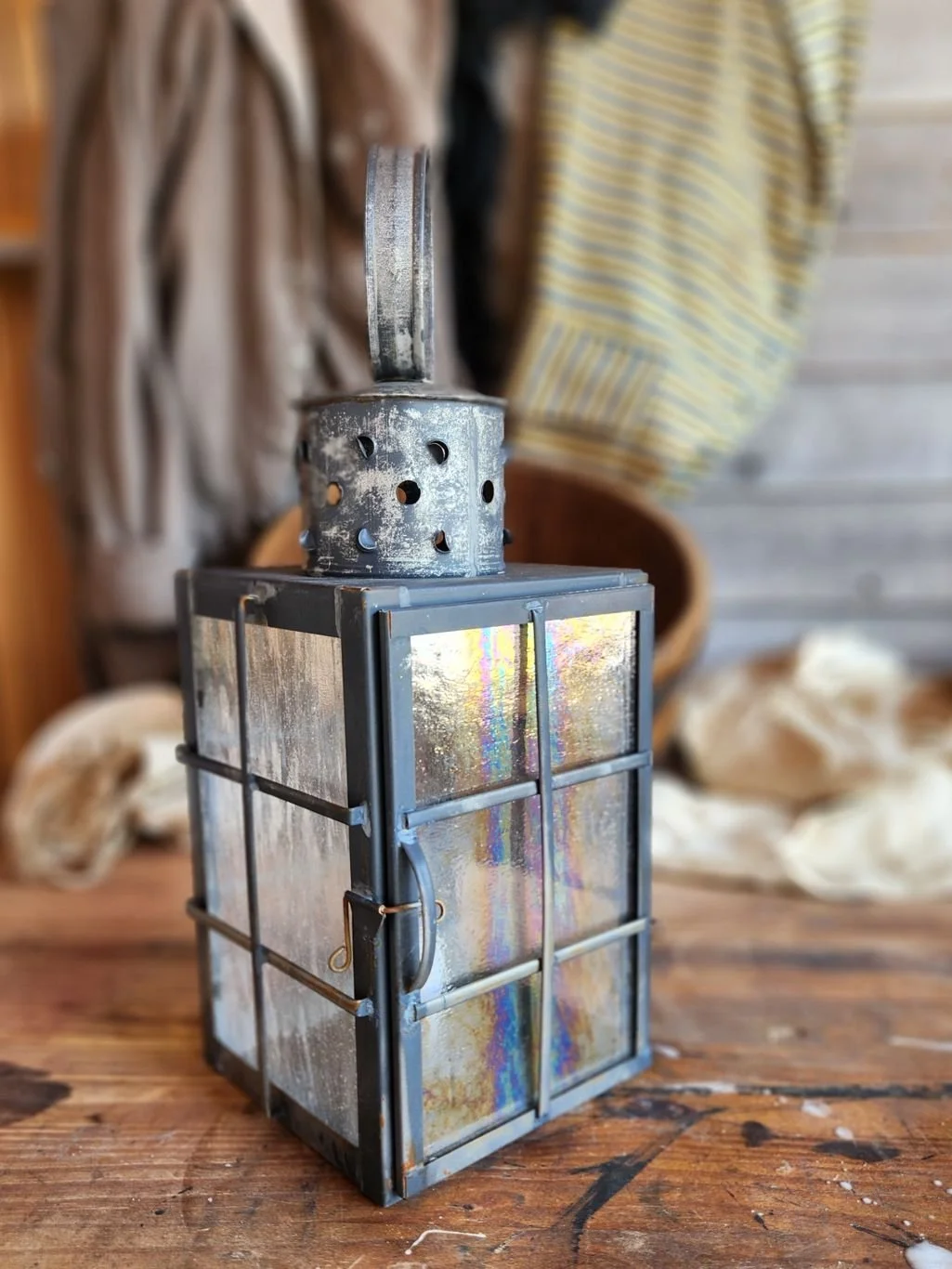 Square handmade tin ship lantern with distressed finish.