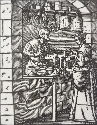 16th century woodcut of a lantern maker working in his workshop.