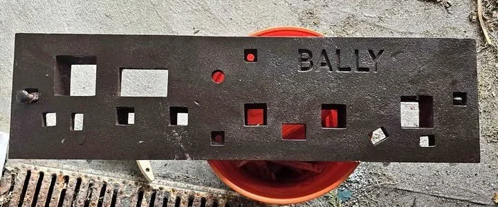 A photograph of a Bally Company cast iron stake plate