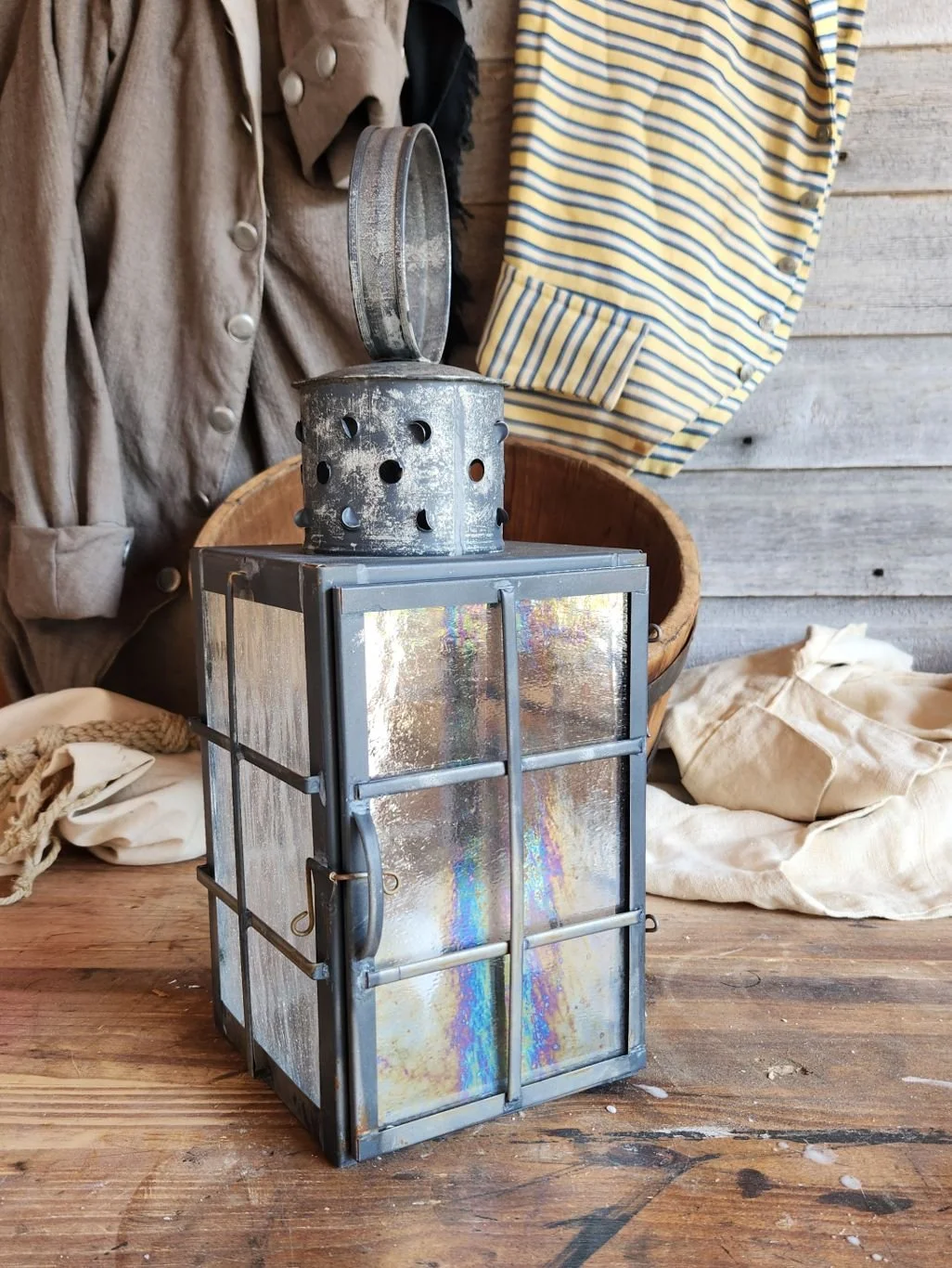 Square tin ship lantern with antique finish.