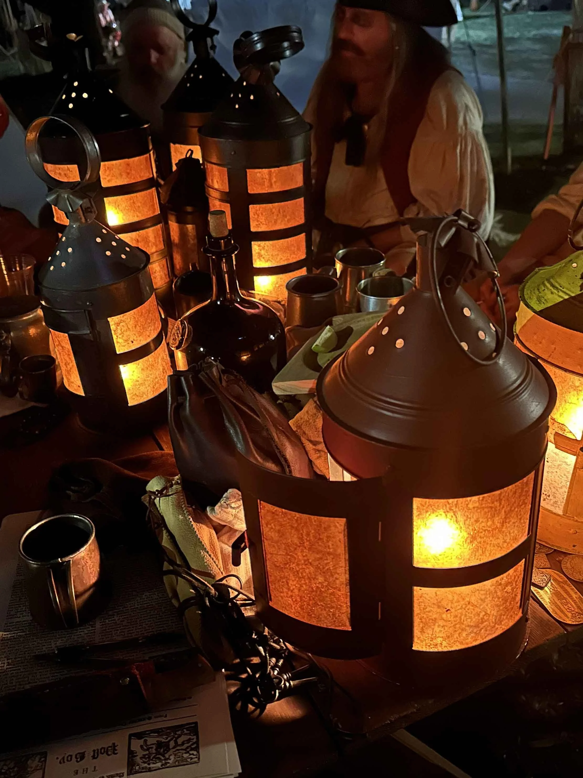 Kates Round Ship Lantern sitting in a group of other lanterns.