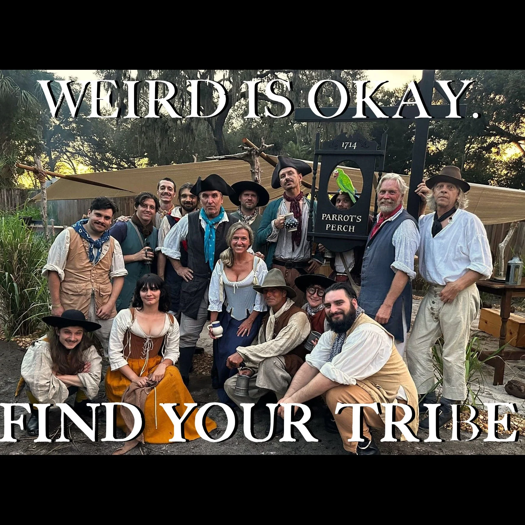 Group of people dressed in historical or pirate-themed costumes standing together in front of a sign that says "Parrot's Perch," with text "Weird is okay. Find your tribe." above and below the group.
