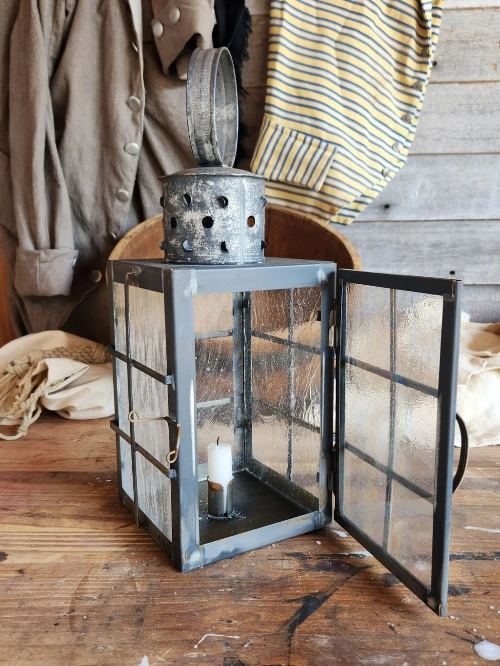 Antiqued square tin ship lantern with wavy glass.