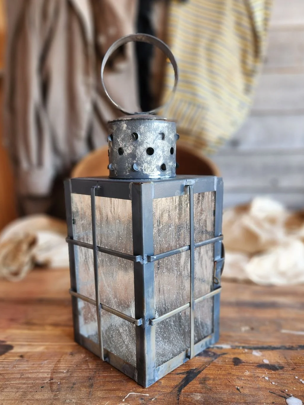Square ship lantern with wavy glass and antique finish.
