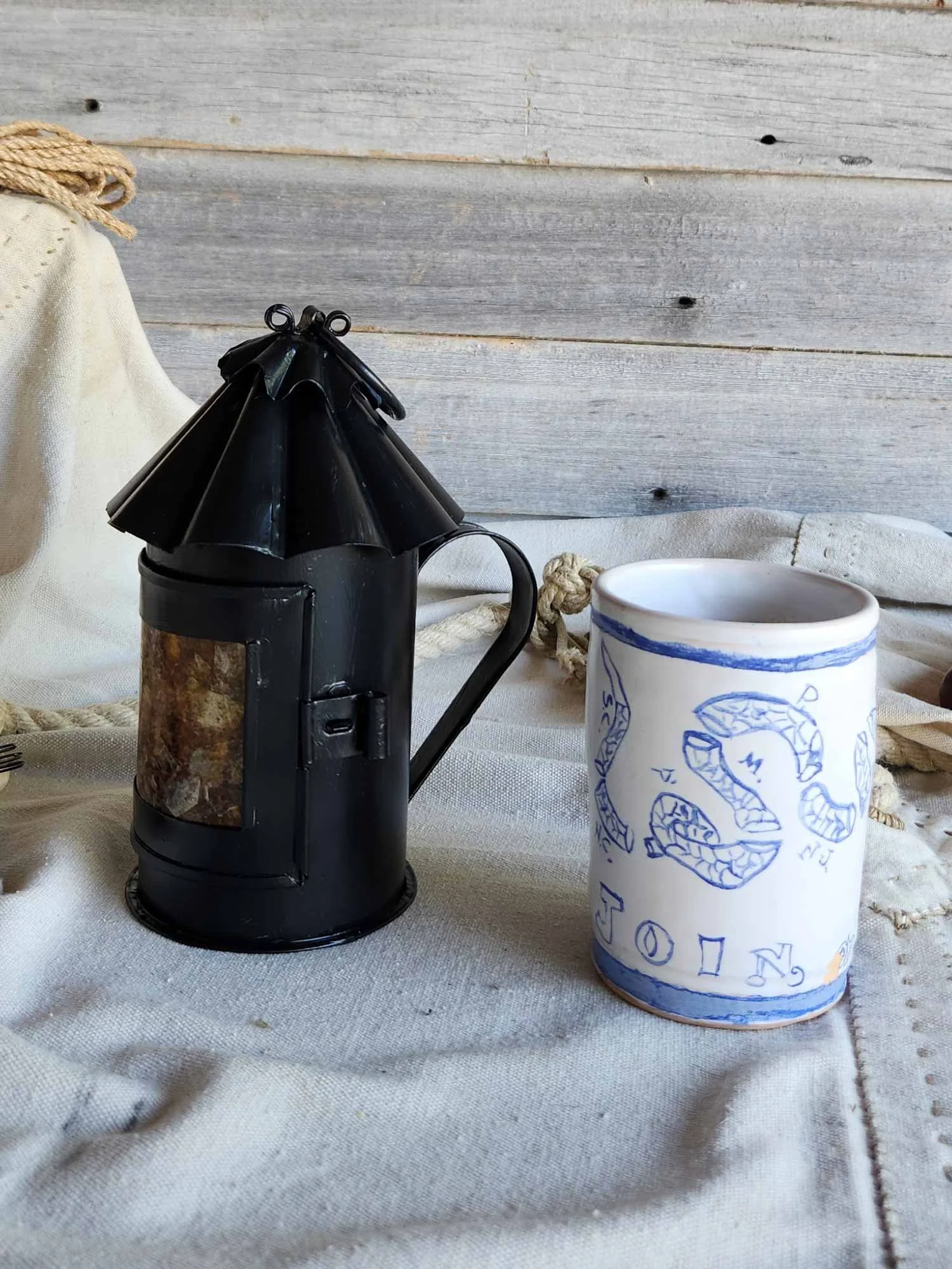 Black "Honest Lantern" with amber door pane