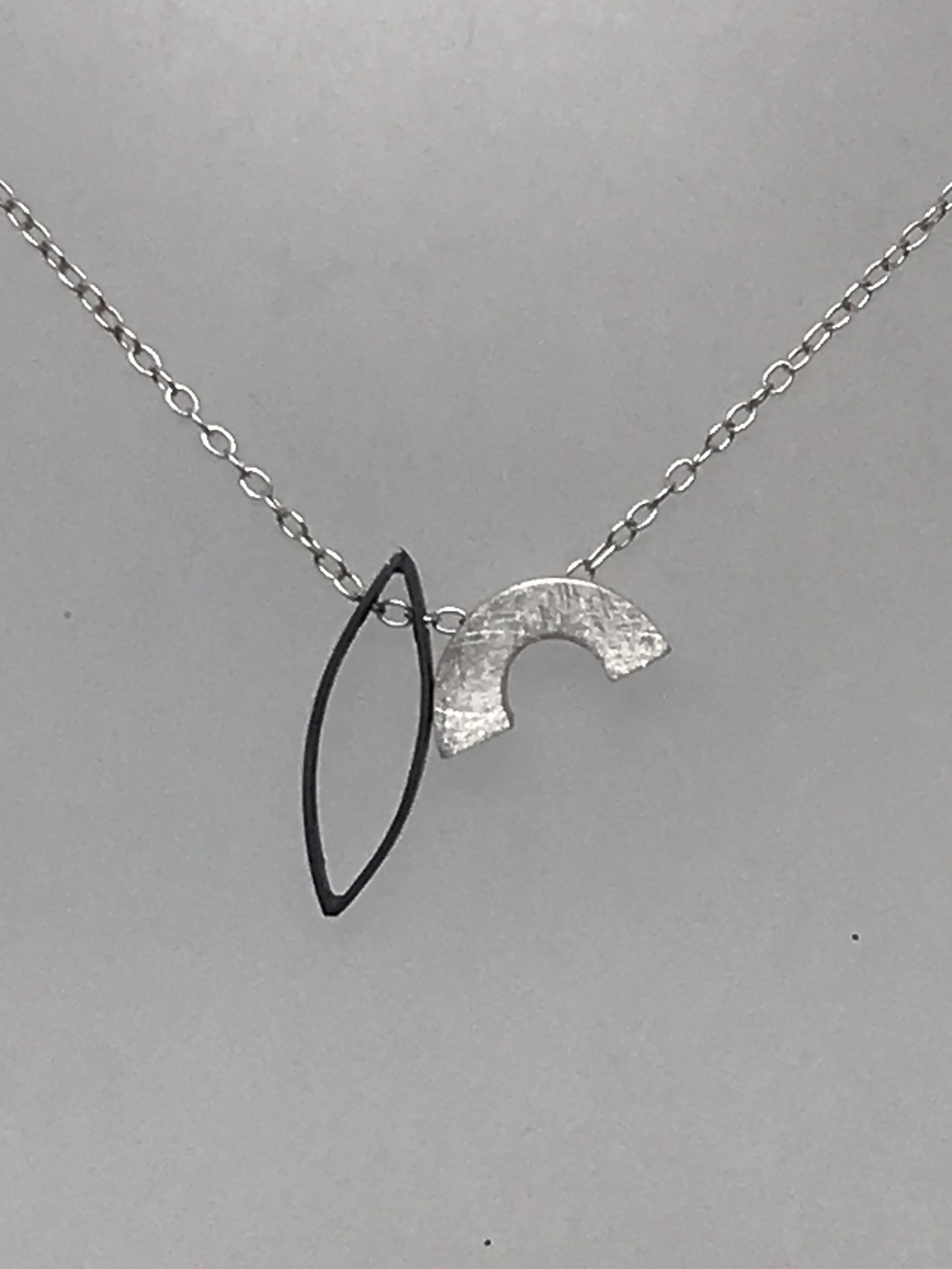 Marquis outline and hollow rainbow necklace close up.jpg
