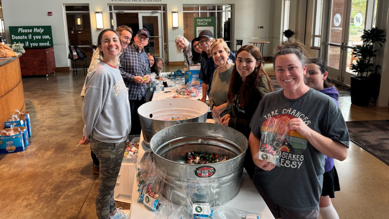 Serve Sunday Participants stuffing thank you bags for teachers.
