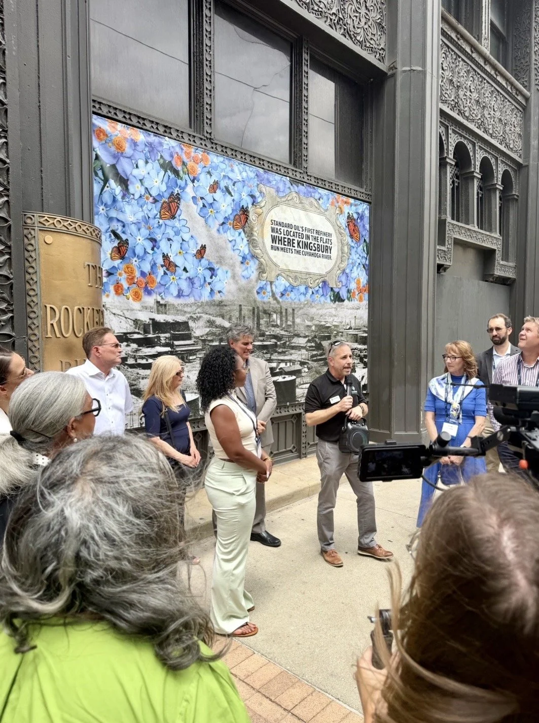 Artist Asia Armour at a public art event in front of her Rockefeller Building floral installation in Cleveland.