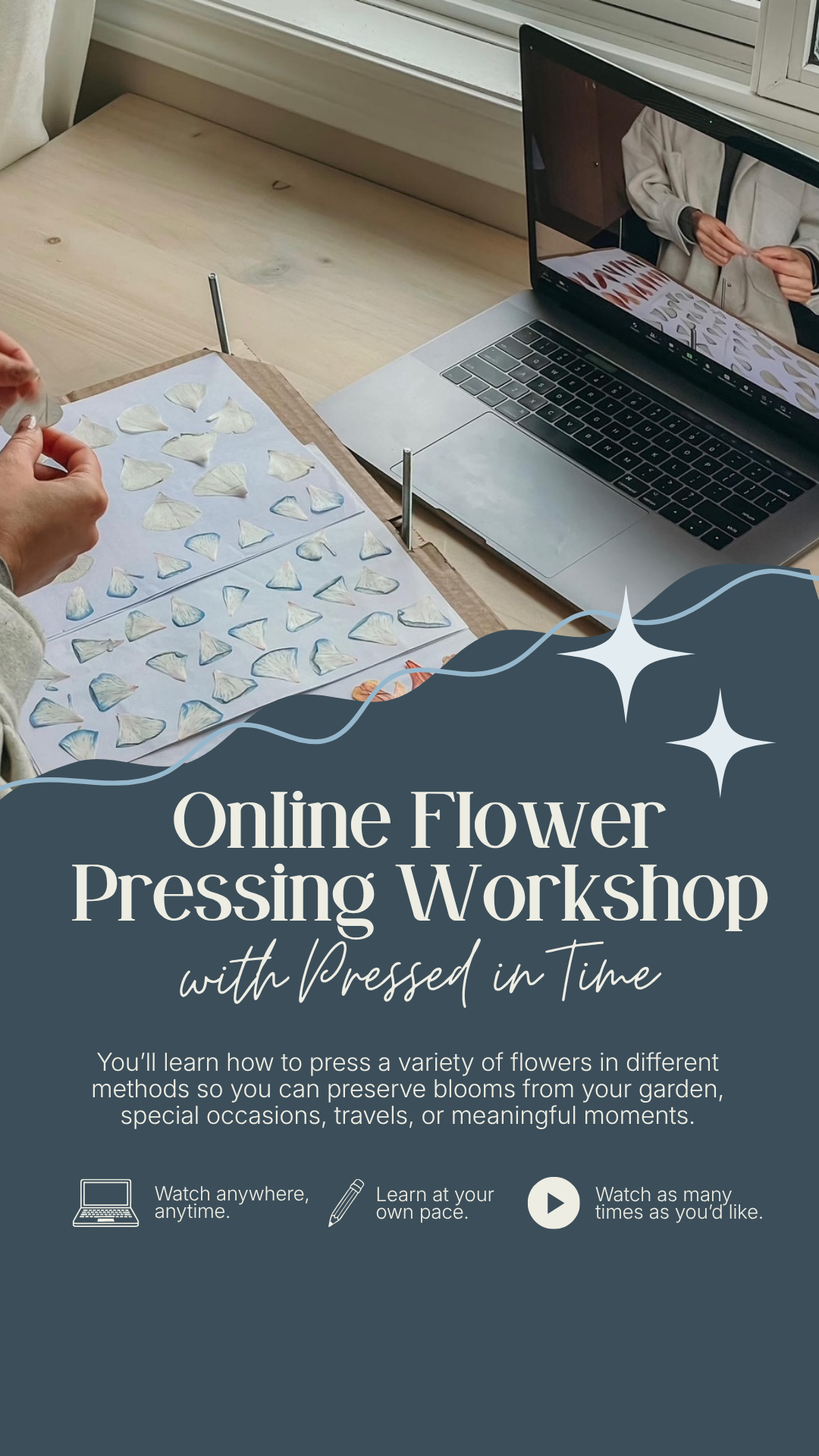 A person is working on a flower pressing project, arranging white flower petals on paper with pressing tools on a wooden table next to a laptop that displays the flowers and a person in a beige jacket.
