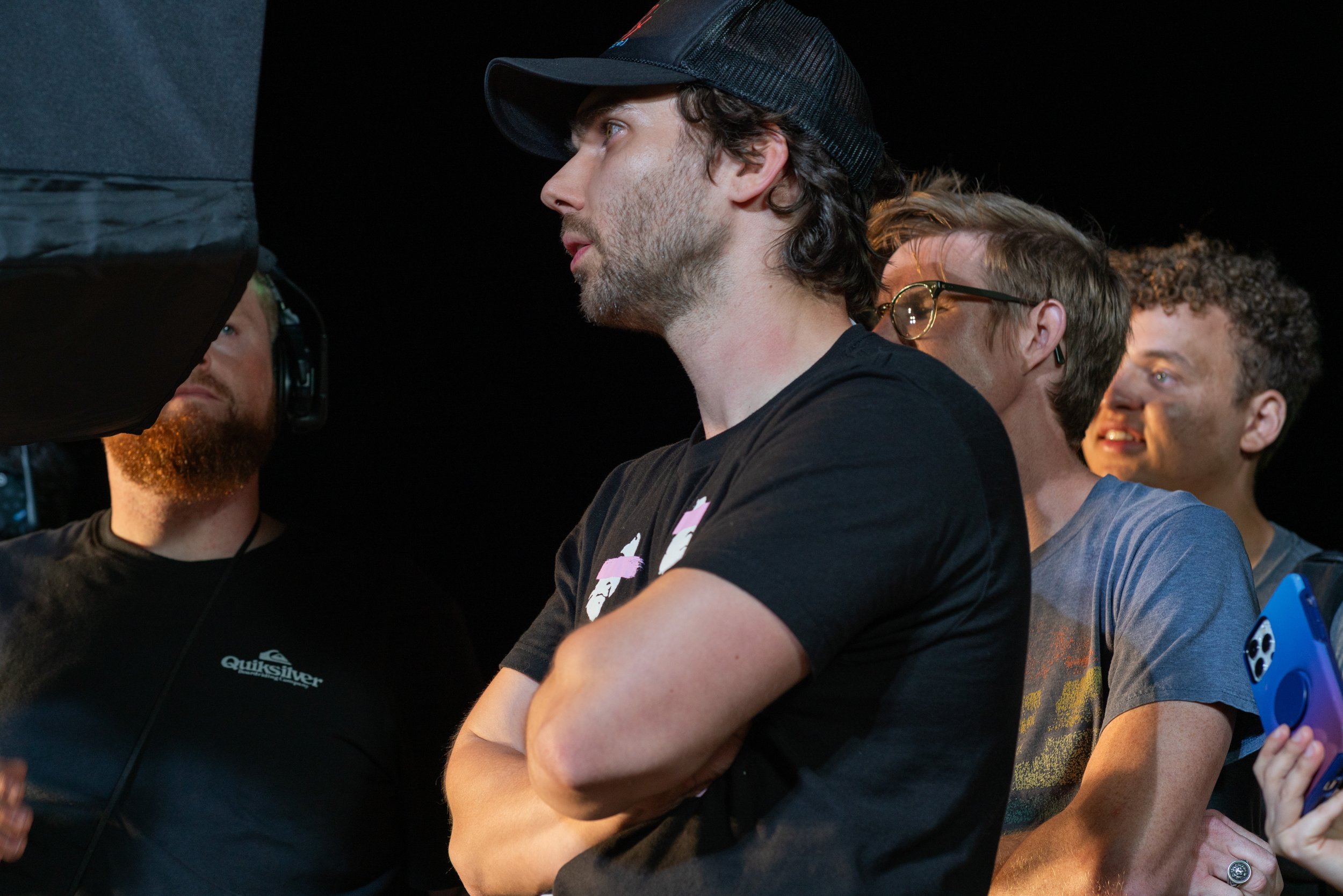 Director, Jerry Nikolaev, reviewing the slow motion take while surrounded by director of photography, producer, and assistance director.