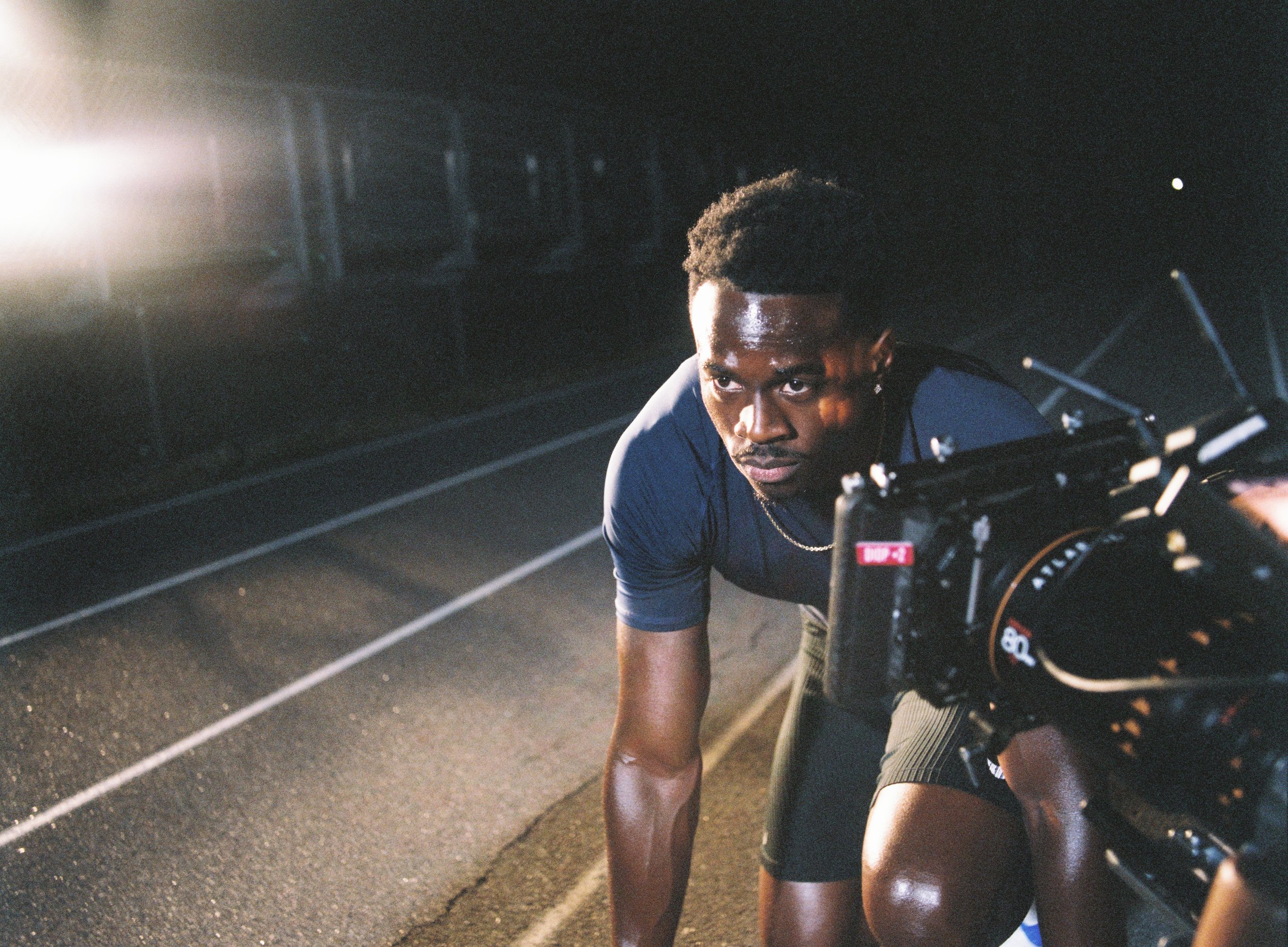 Framing the night shot before calling action with Aaron Brown lining up on the track, shot with the Freefly Ember paired with Atlas Orion lenses.