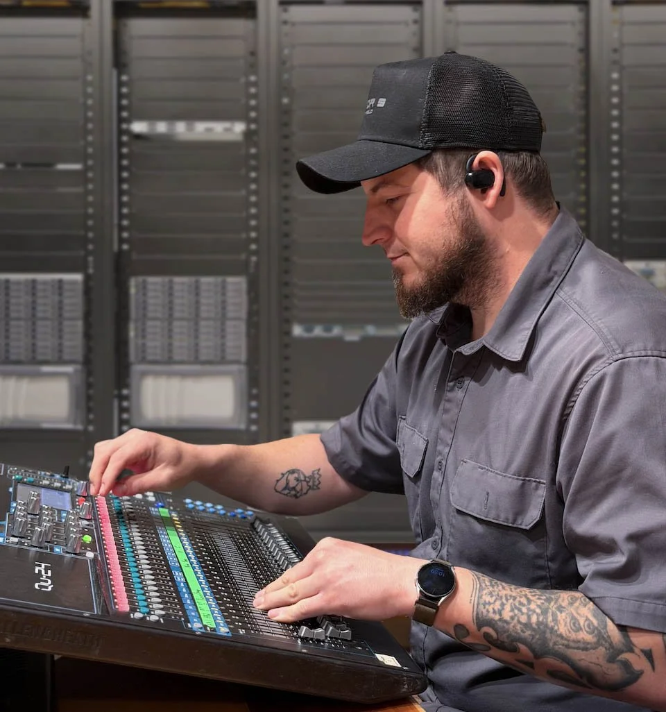 Technician Adjusting Equipment