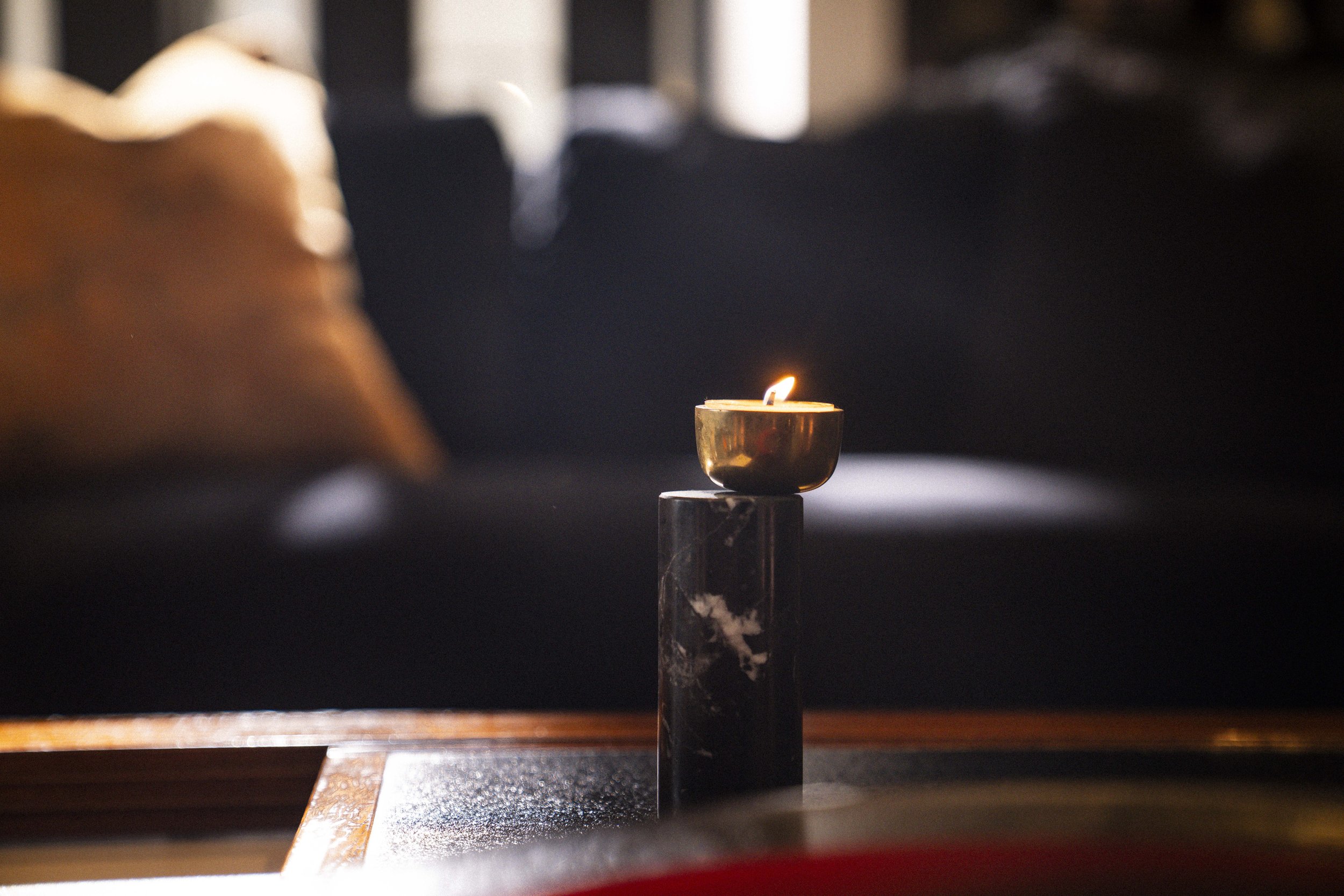 The simple elegance of the Luca Nichetto tealight candle holder adorns the client's original Bernard Vuarnesson Hexa Modular coffee table, creating an effortless style to the space.