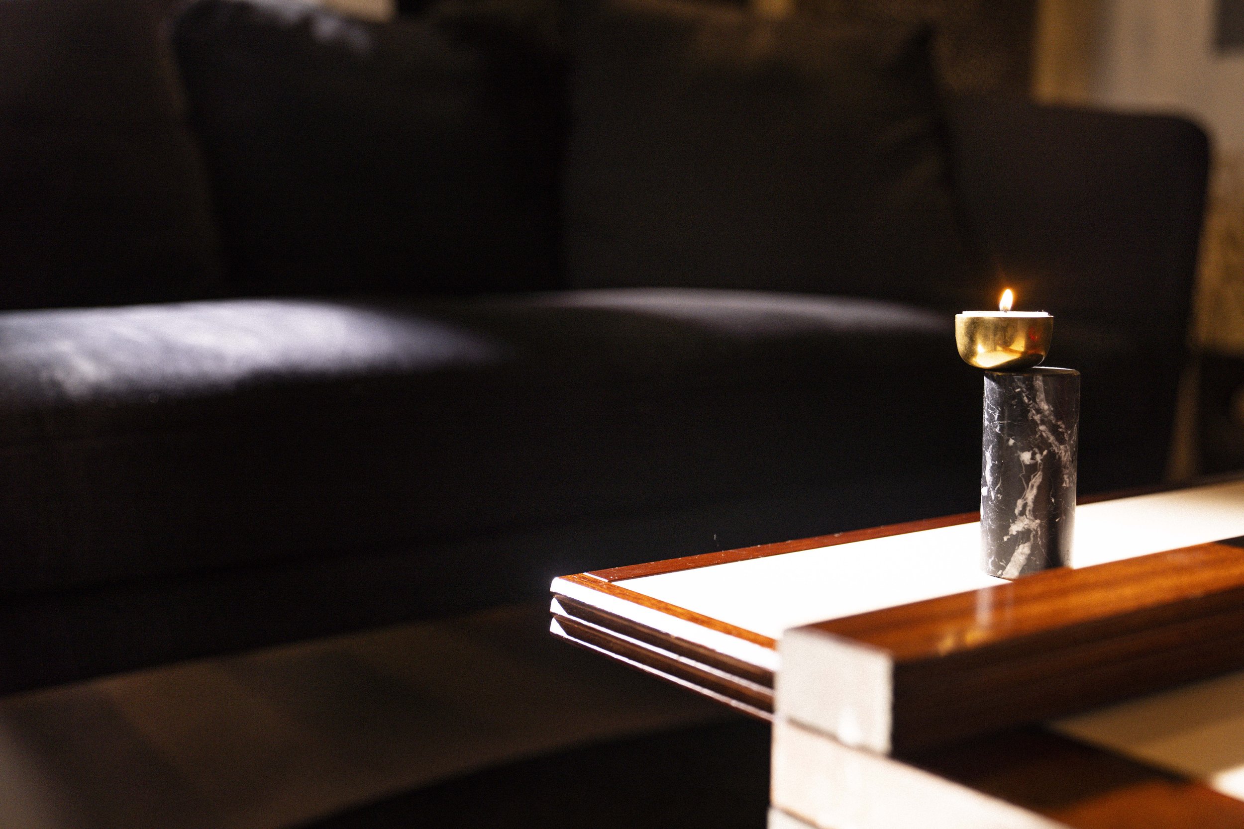 The simple elegance of the Luca Nichetto tealight candle holder adorns the client's original Bernard Vuarnesson Hexa Modular coffee table.