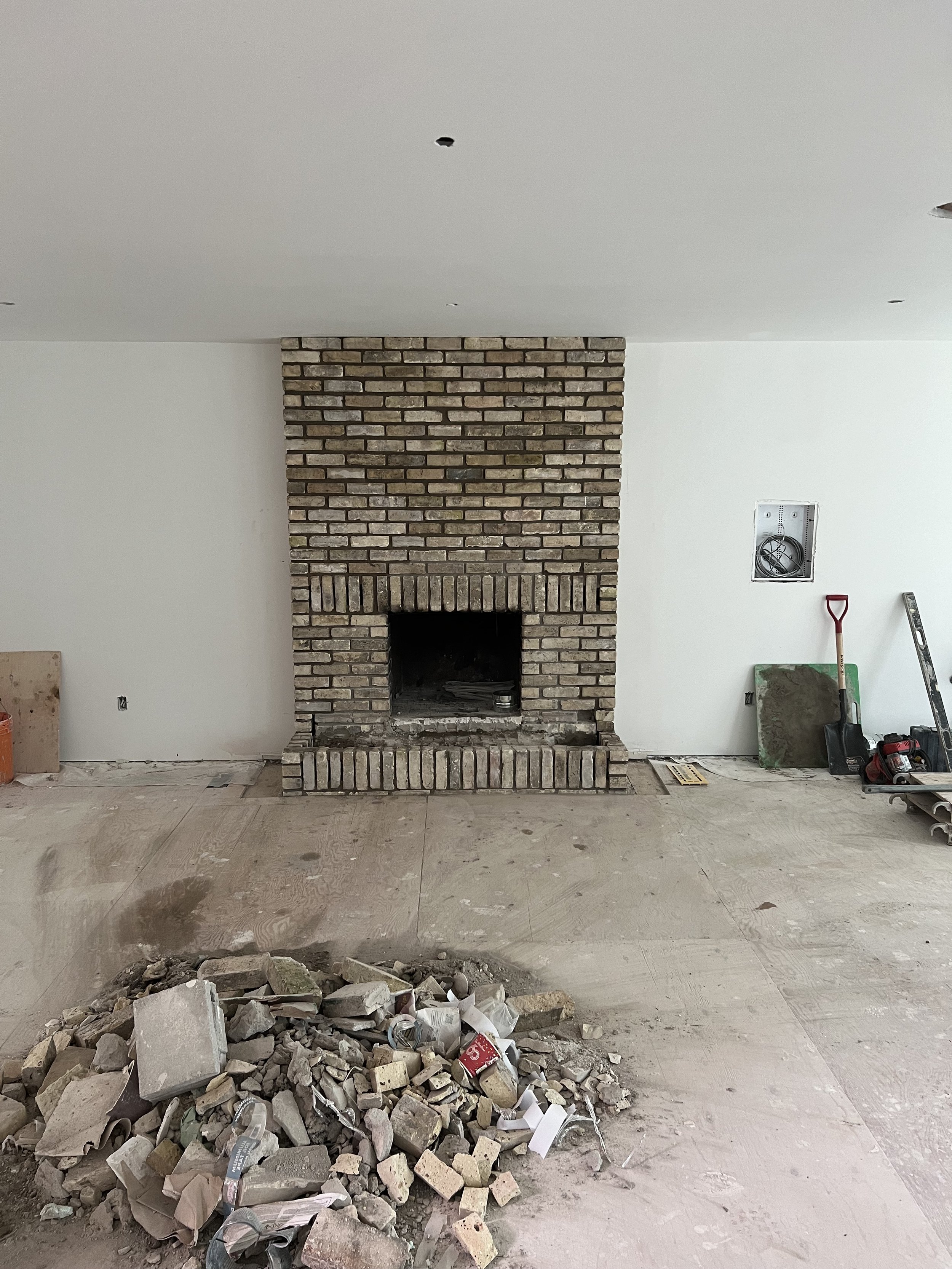 Custom build wood burning brick fireplace in Komoka, ON