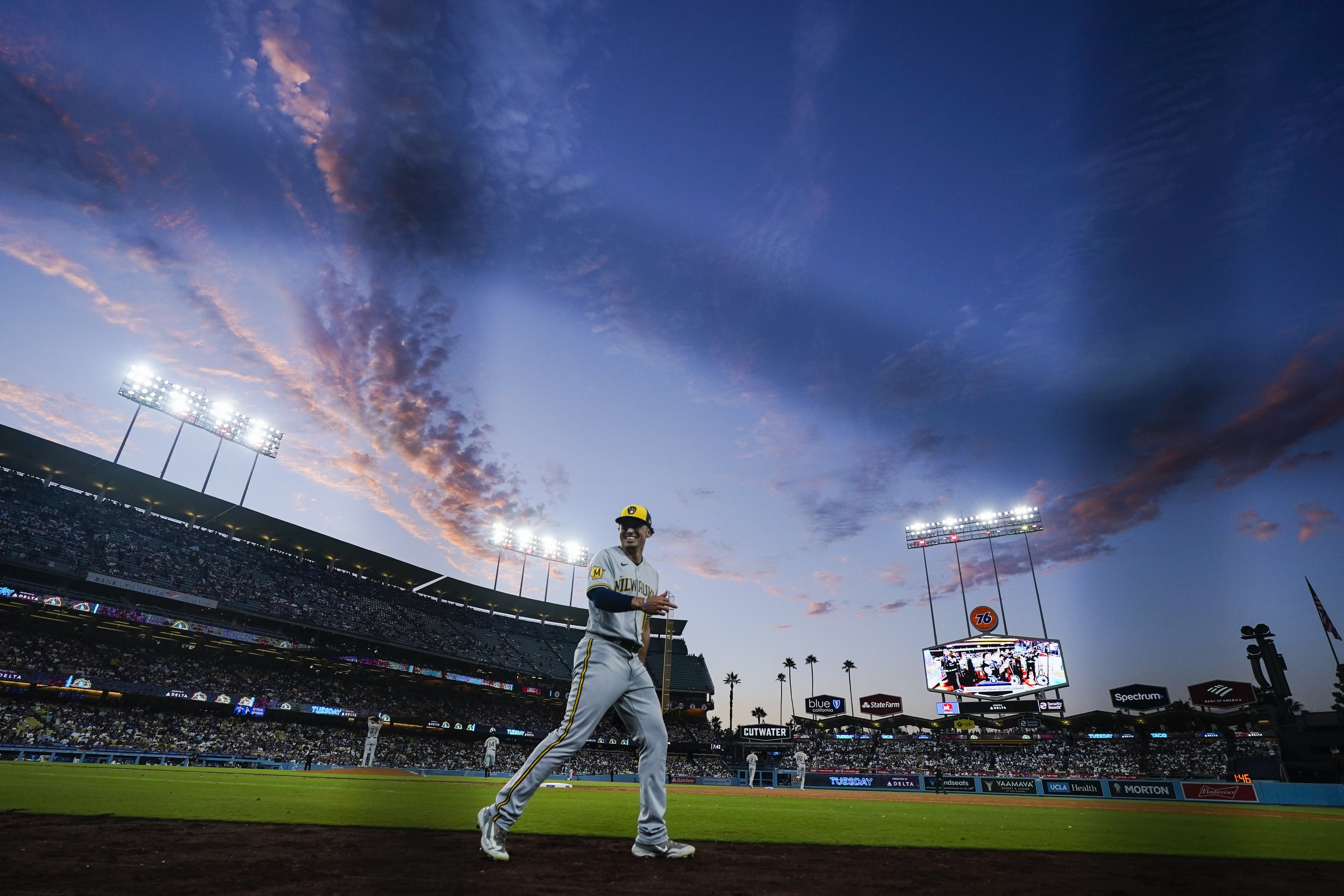  Milwaukee Brewers right fielder Tyrone Taylor talks takes to the field during the third inning of a baseball game against the Los Angeles Dodgers, Tuesday, Aug. 15, 2023, in Los Angeles. 