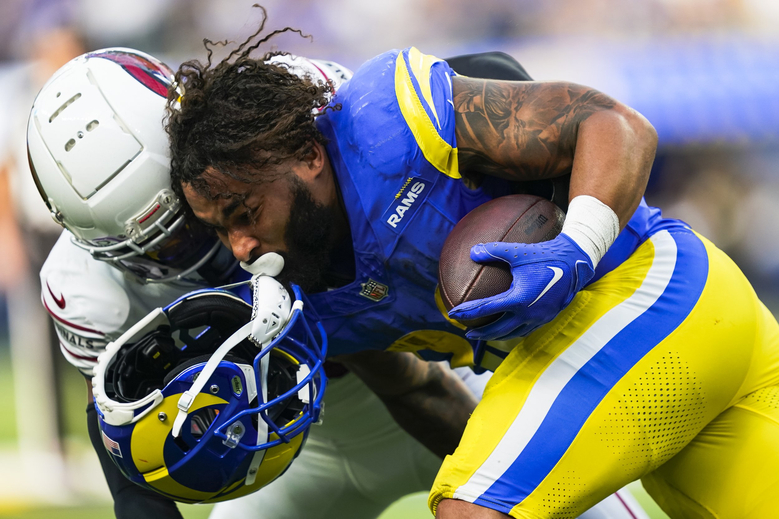  Los Angeles Rams running back Kyren Williams (23) is tackled by Arizona Cardinals cornerback Marco Wilson (20) during the second half of an NFL football game Sunday, Oct. 15, 2023, in Inglewood, Calif.  