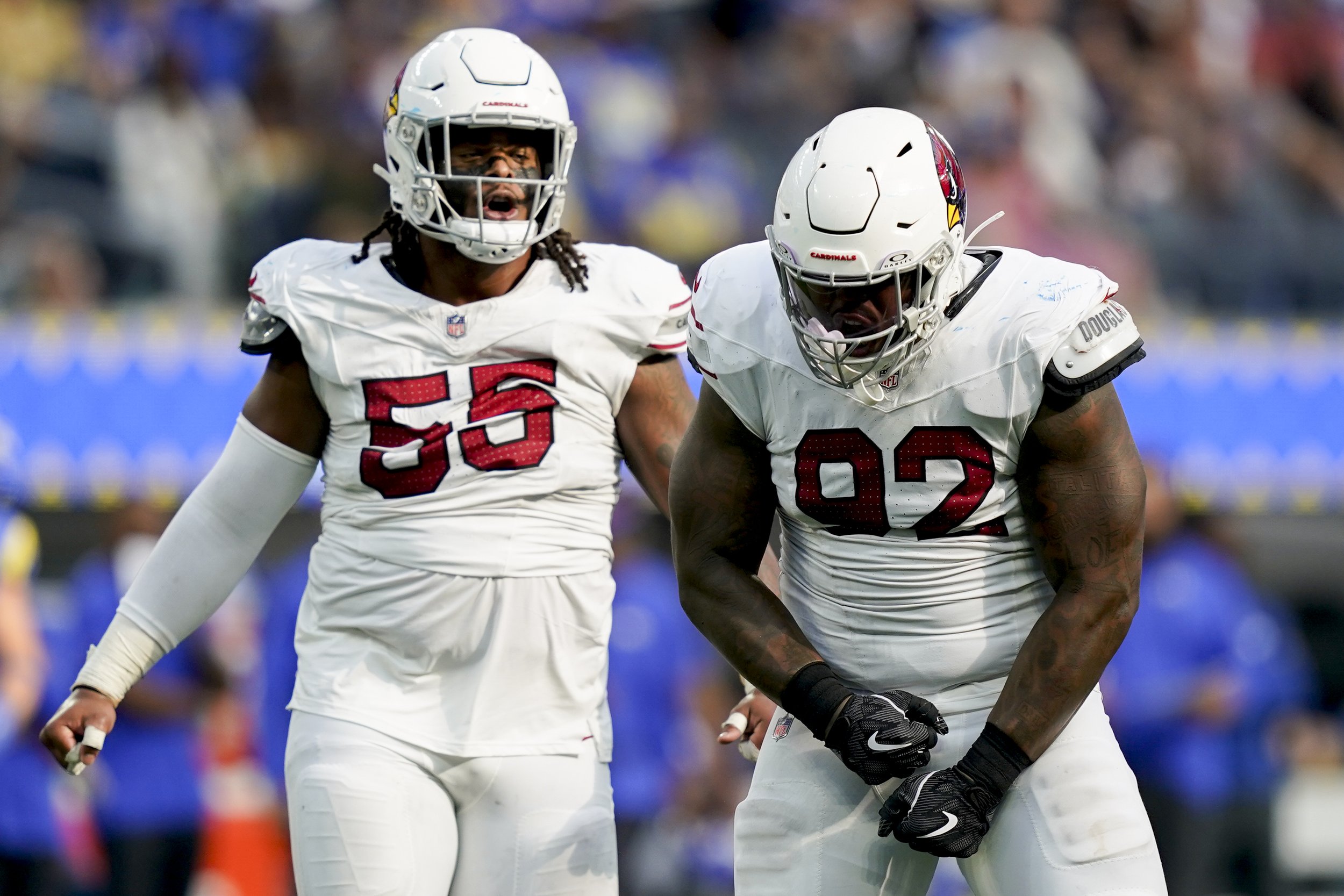  Arizona Cardinals defensive end Kevin Strong (92) reacts after a tackle next to defensive tackle Dante Stills (55) during the second half of an NFL football game against the Los Angeles Rams Sunday, Oct. 15, 2023, in Inglewood, Calif. 