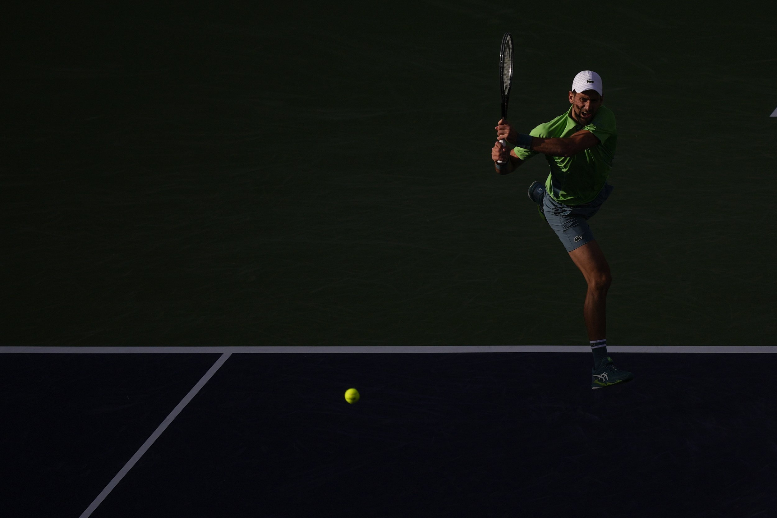  Novak Djokovic, of Serbia, returns to Aleksandar Vukic, of Australia, at the BNP Paribas Open tennis tournament, Saturday, March 9, 2024, in Indian Wells, Calif. 