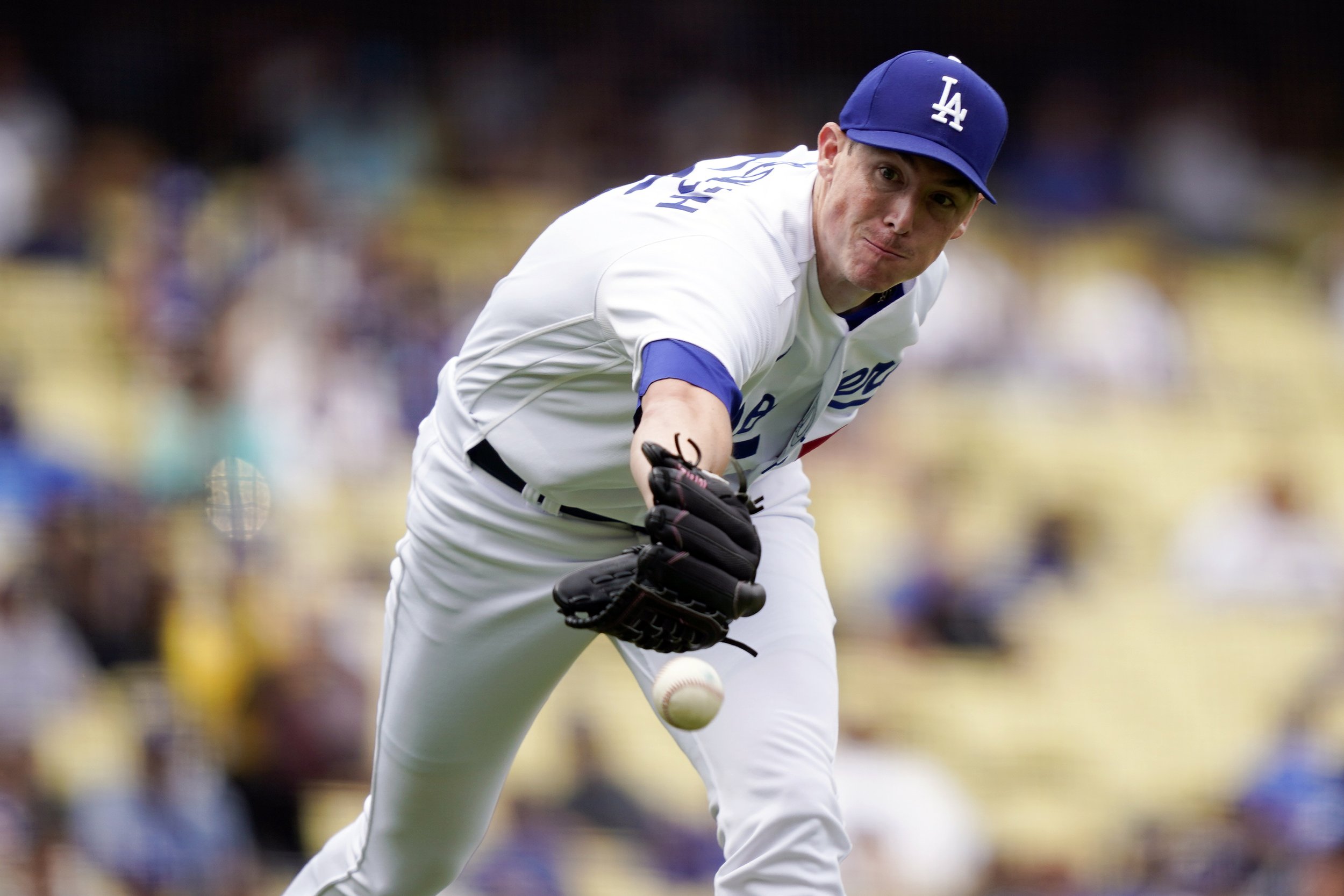  Los Angeles Dodgers relief pitcher Ryan Yarbrough attempts to field a grounder by Miami Marlins' Luis Arraez during the eighth inning in the first baseball game of a doubleheader, Saturday, Aug. 19, 2023, in Los Angeles. Arraez was out at first afte