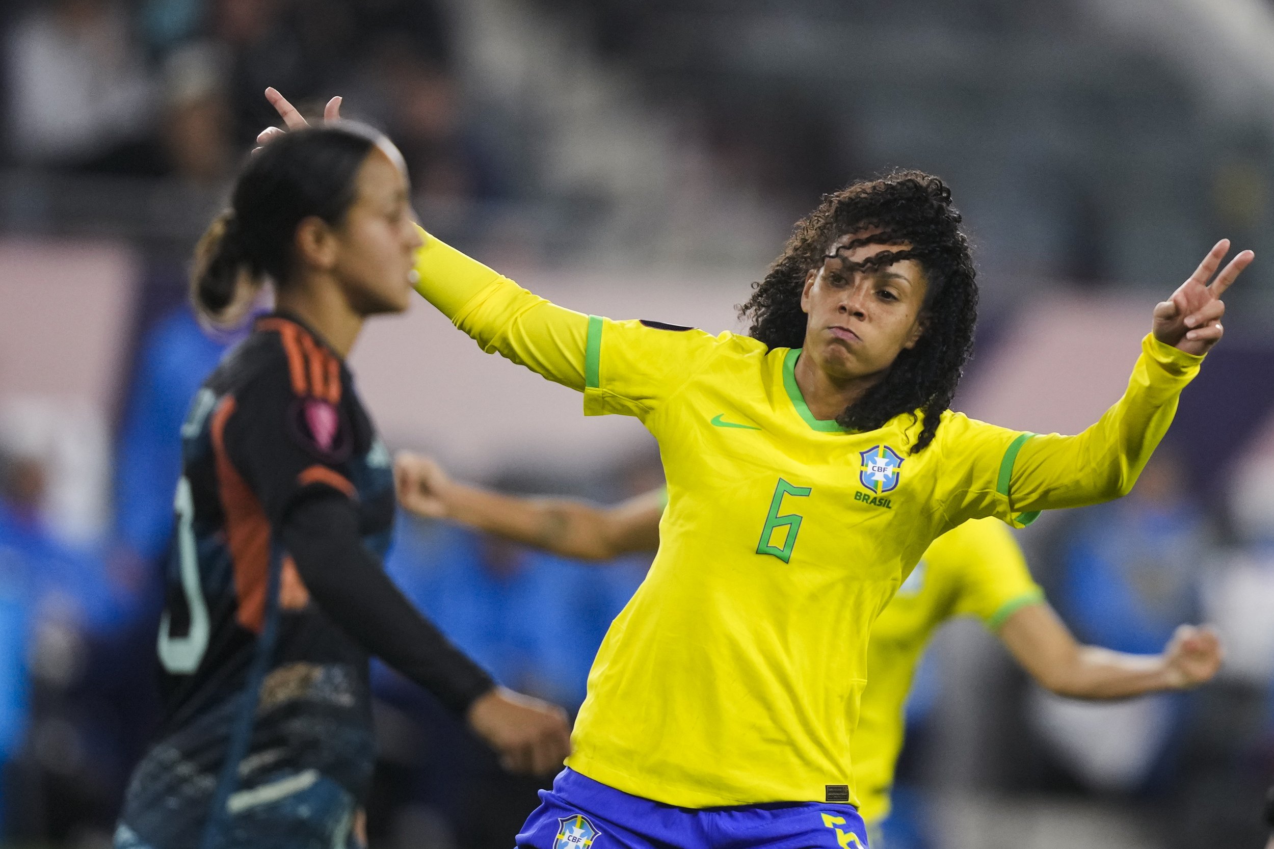  Brazil defender Yasmim, right, celebrates her goal, near Argentina midfielder Dalila Ippolito, during the first half of a CONCACAF Gold Cup women's soccer tournament quarterfinal Saturday, March 2, 2024, in Los Angeles. 