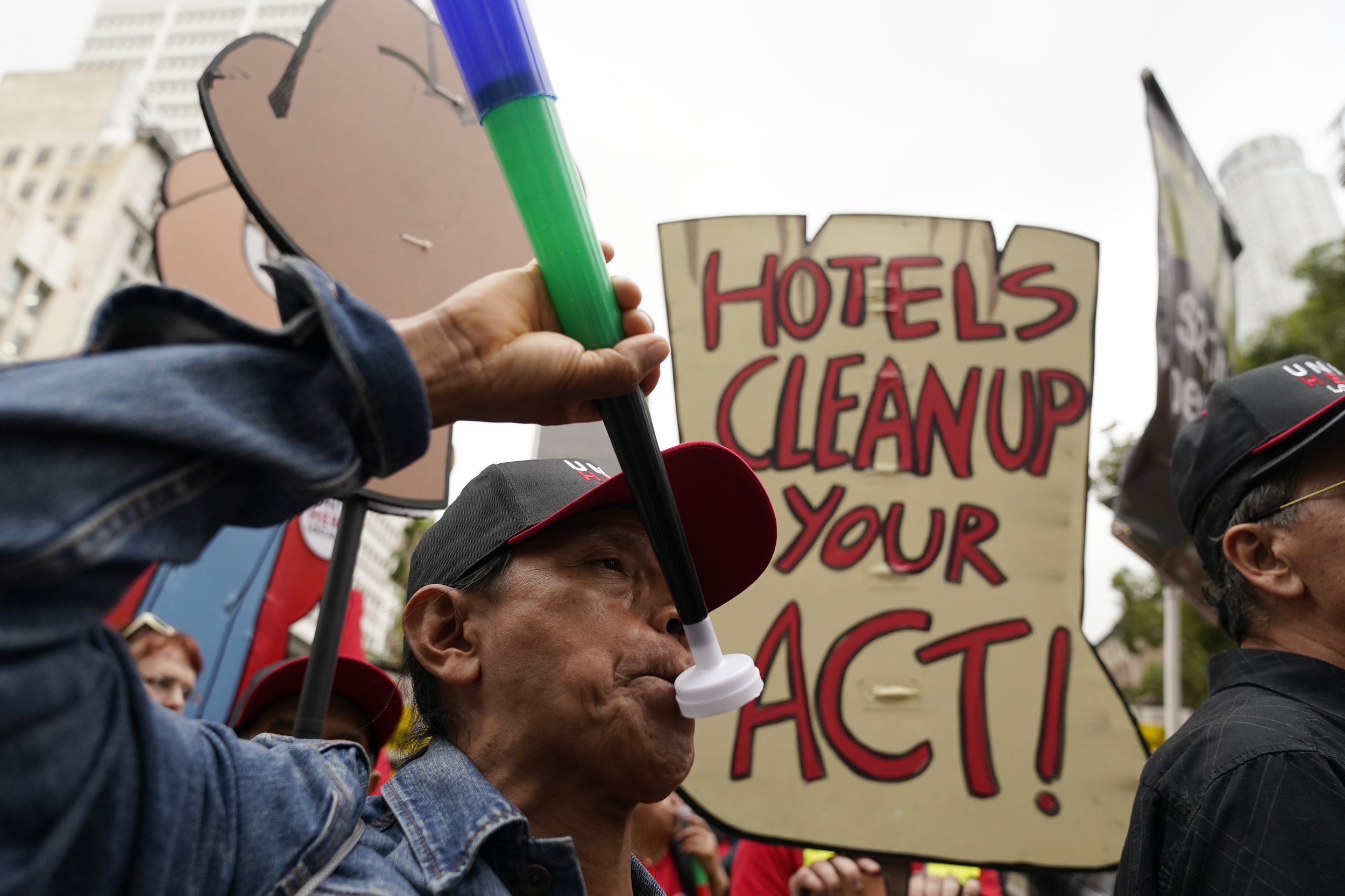  Hotel workers march to demand better wages Wednesday, Oct. 25, 2023, in Los Angeles.  