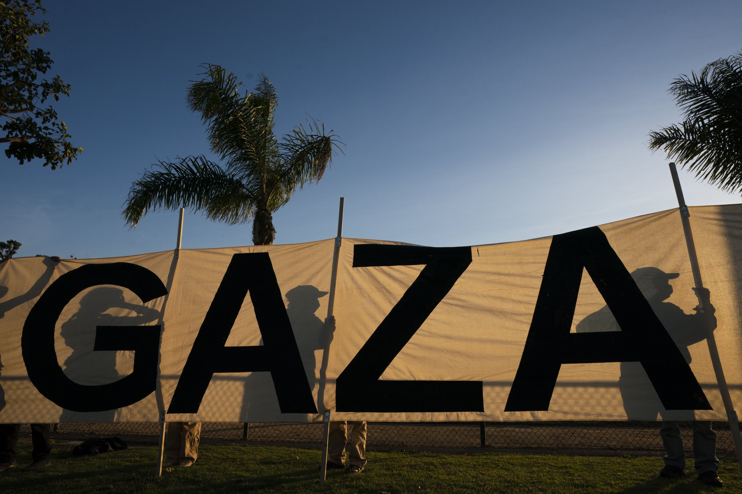  Protesters hold up a sign stating "Let Gaza Live" during a rally in support of Palestinians, Friday, Dec. 15, 2023, in Los Angeles. 