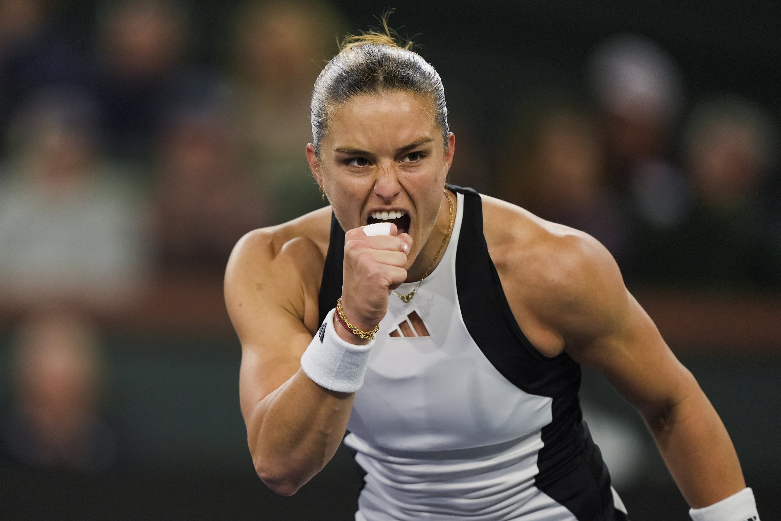  Maria Sakkari, of Greece, celebrates winning a game over Coco Gauff, of the United States, during a semifinal match at the BNP Paribas Open tennis tournament in Indian Wells, Calif., Friday, March 15, 2024. (AP Photo/Ryan Sun) 