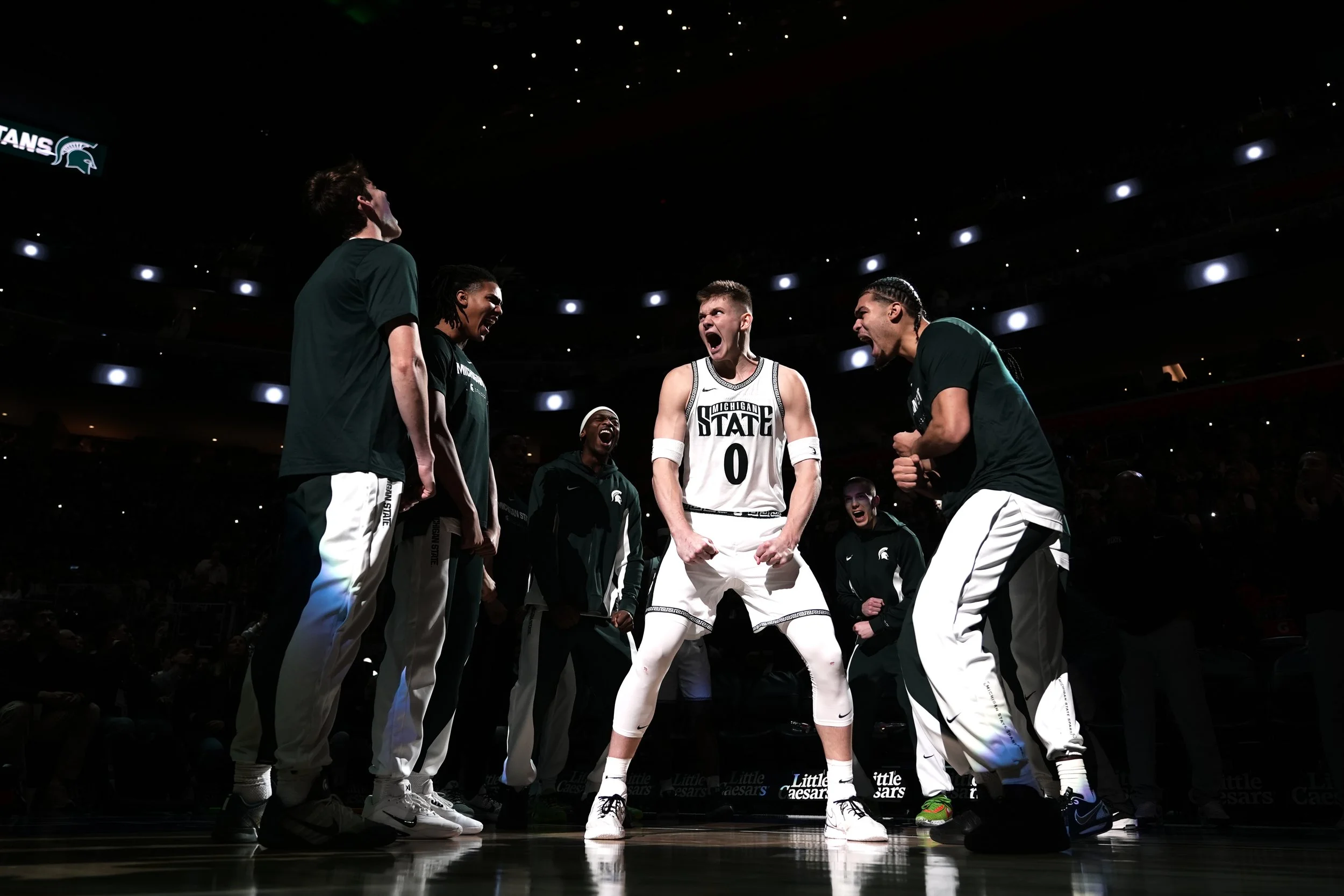  Michigan State forward Jaxon Kohler, center, reacts before being introduced during the first half of an NCAA college basketball game against Oakland, Saturday, Dec. 20, 2025, in Detroit. (AP Photo/Ryan Sun) 