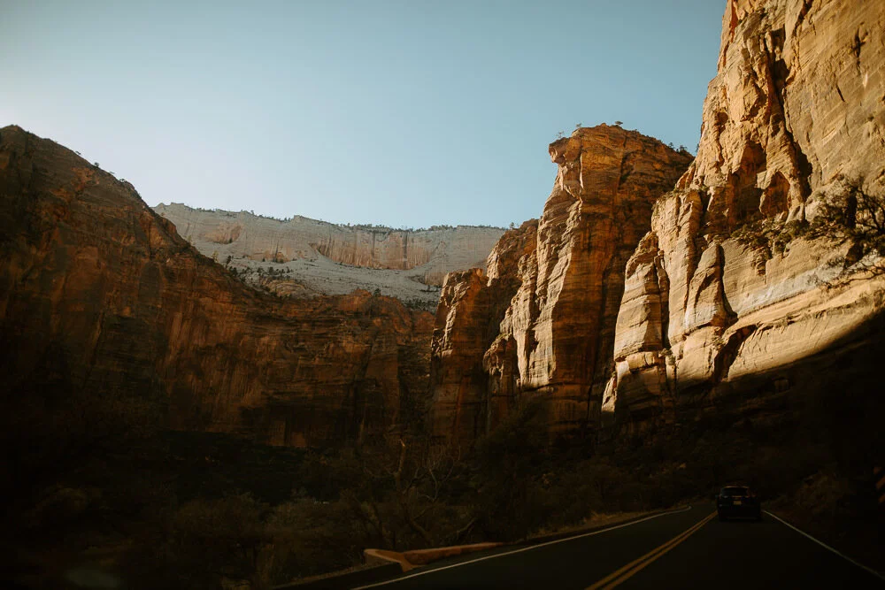 Scenic view of a winding road through towering red rock canyons