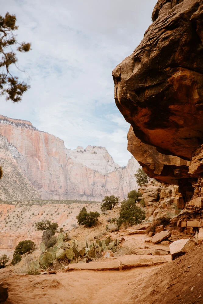 Desert hiking trail winding along a rocky cliffside