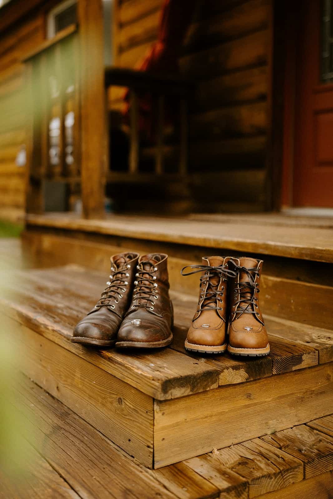 Redwing boots sitting on a wood porch step