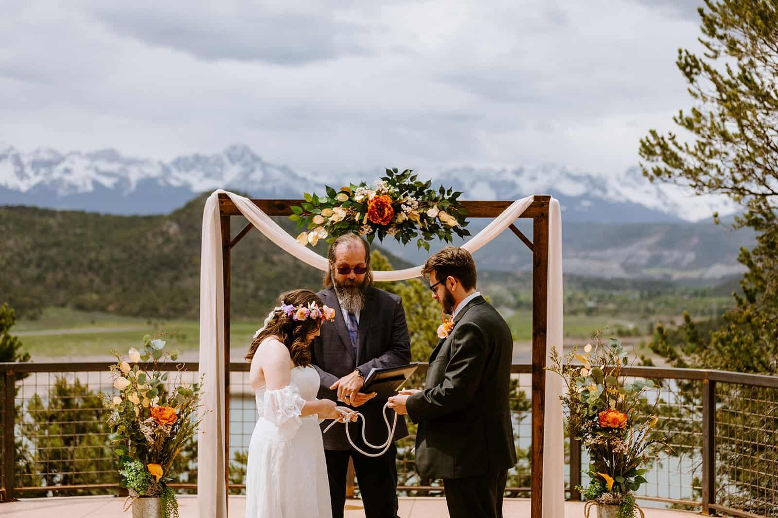 A couple does a knot ceremony at their Ridgway State Park Wedding