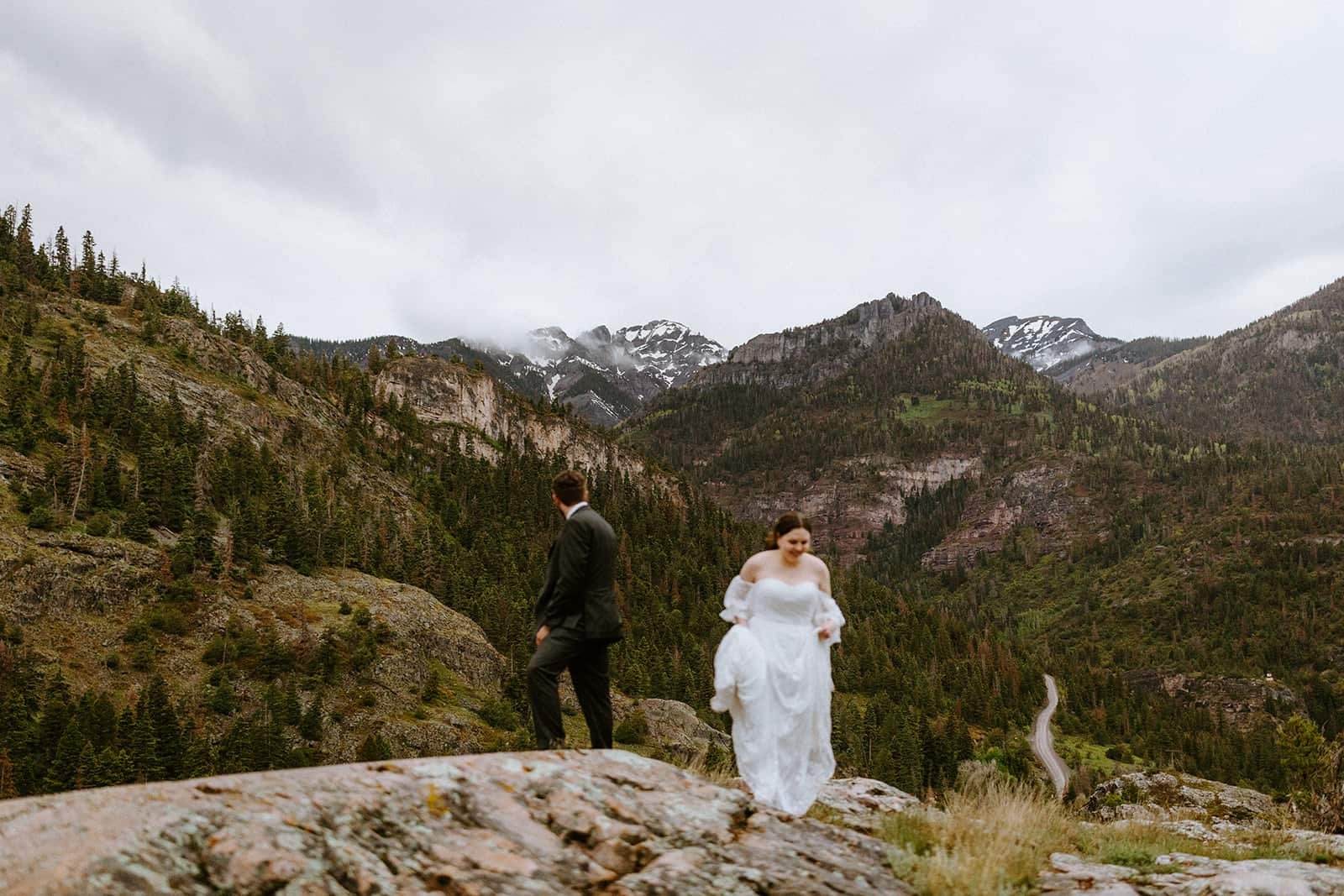 A man and woman explore an overlook off the Million Dollar Highway outside of Ridgway