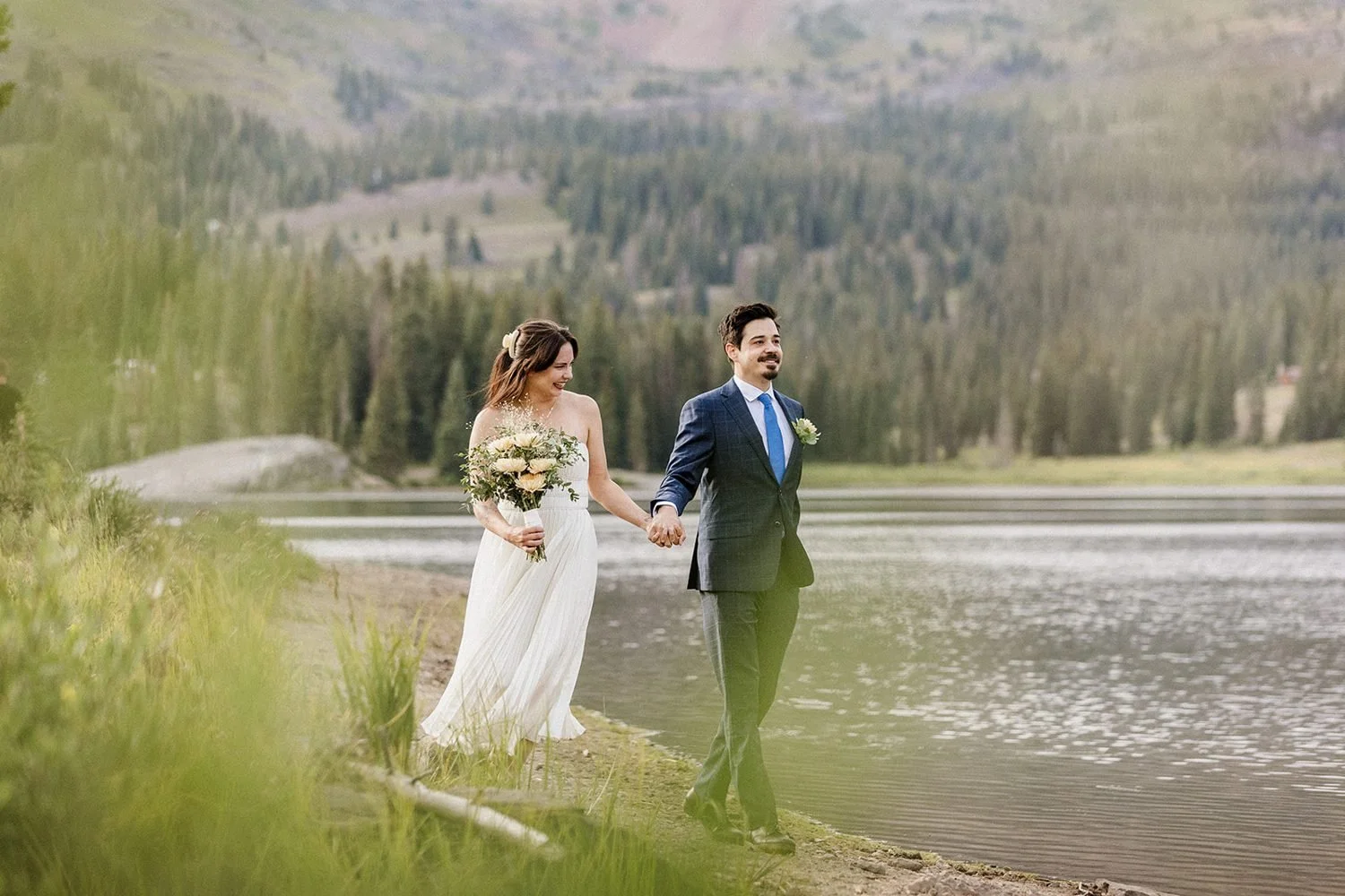 lake-irwin-elopement-crested-butte-26-lakeside-hand-in-hand.jpg