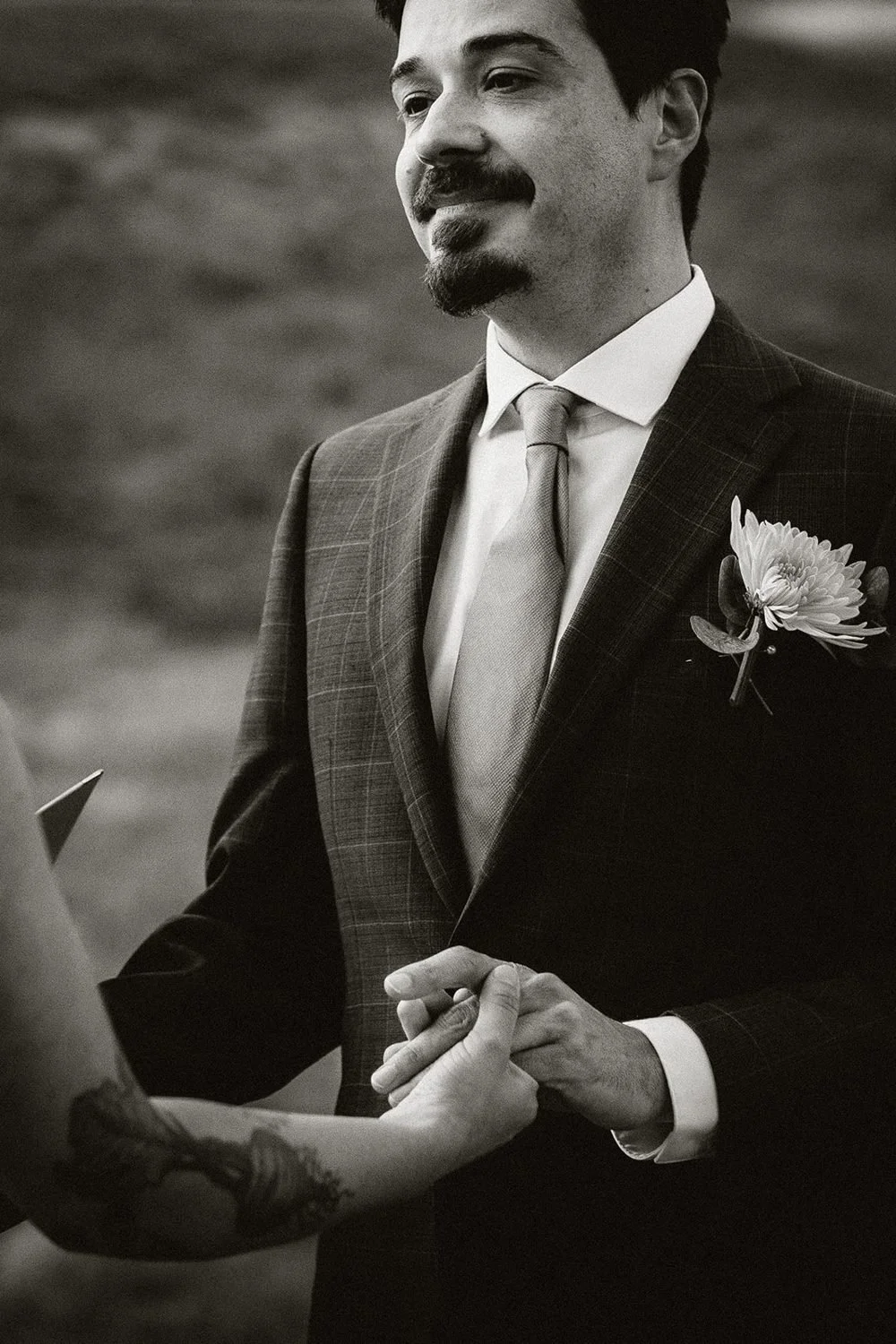 lake-irwin-elopement-crested-butte-49-groom-vows-bw.jpg