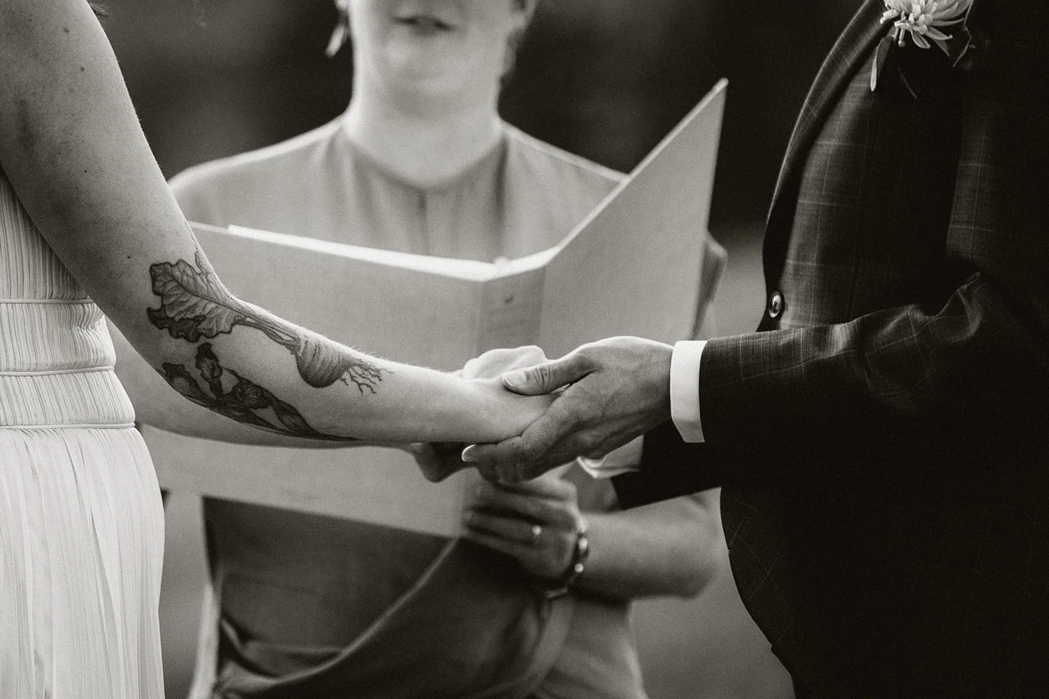 lake-irwin-elopement-crested-butte-55-hands-vow-book-bw.jpg