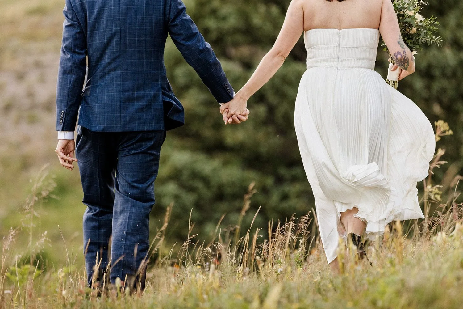lake-irwin-elopement-crested-butte-66-walking-away-hands.jpg